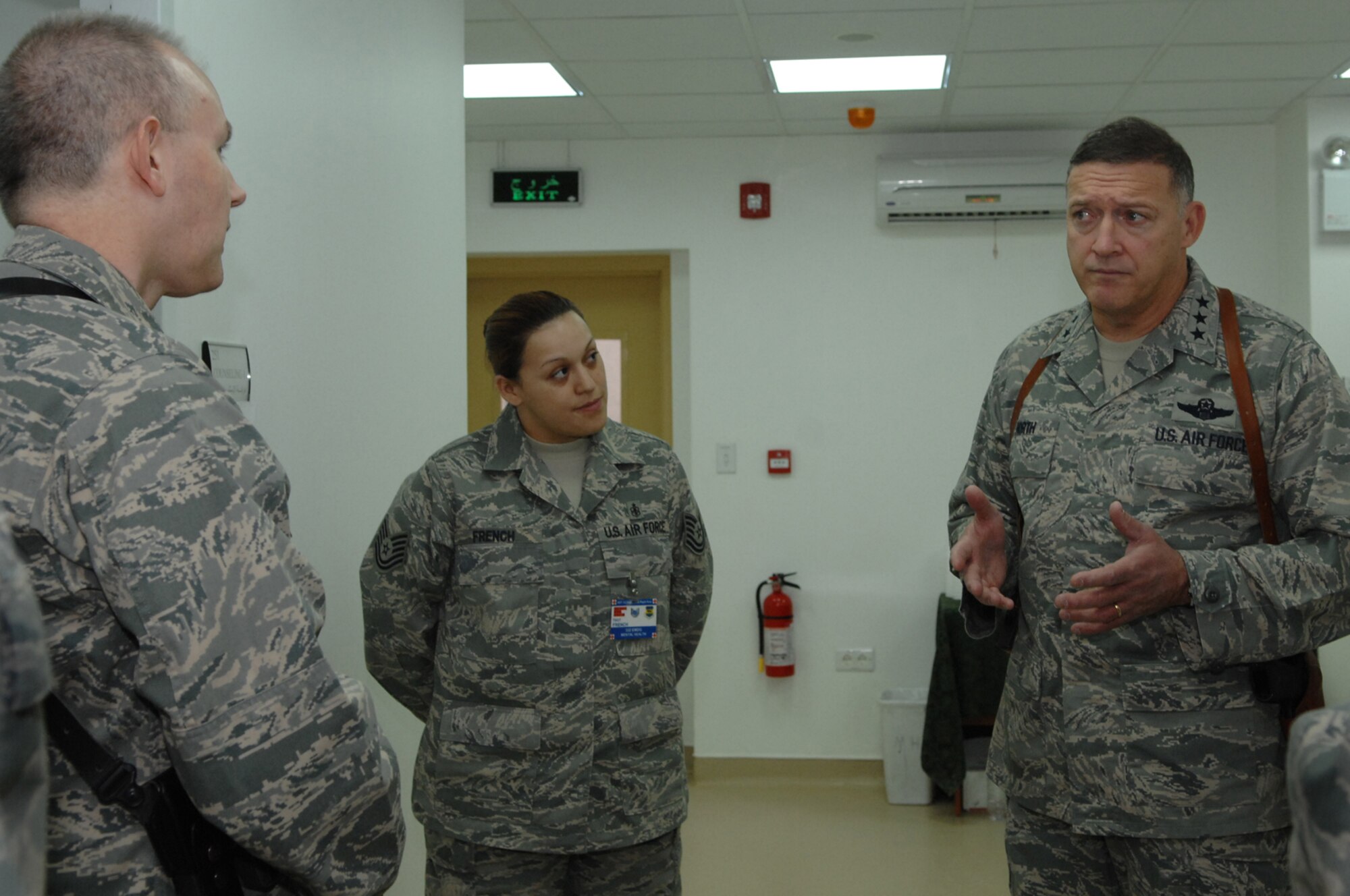 BALAD AIR BASE, Iraq -- Lt. Gen. Gary North, 9th Air Force and U.S. Central Command Air Forces commander, speaks with Lt. Col. Robert Campbell, 332nd Expeditionary Aeromedical Squadron Mental Health Flight commander, regarding the mental health issues that Airmen face while serving in deployed environments. The general toured the various Air Force Theater Hospital clinics Jan. 26. Colonel Campbell is deployed from Wright Patterson Air Force Base, Ohio. (U.S. Air Force photo/ Senior Airman Julieann Showalter)