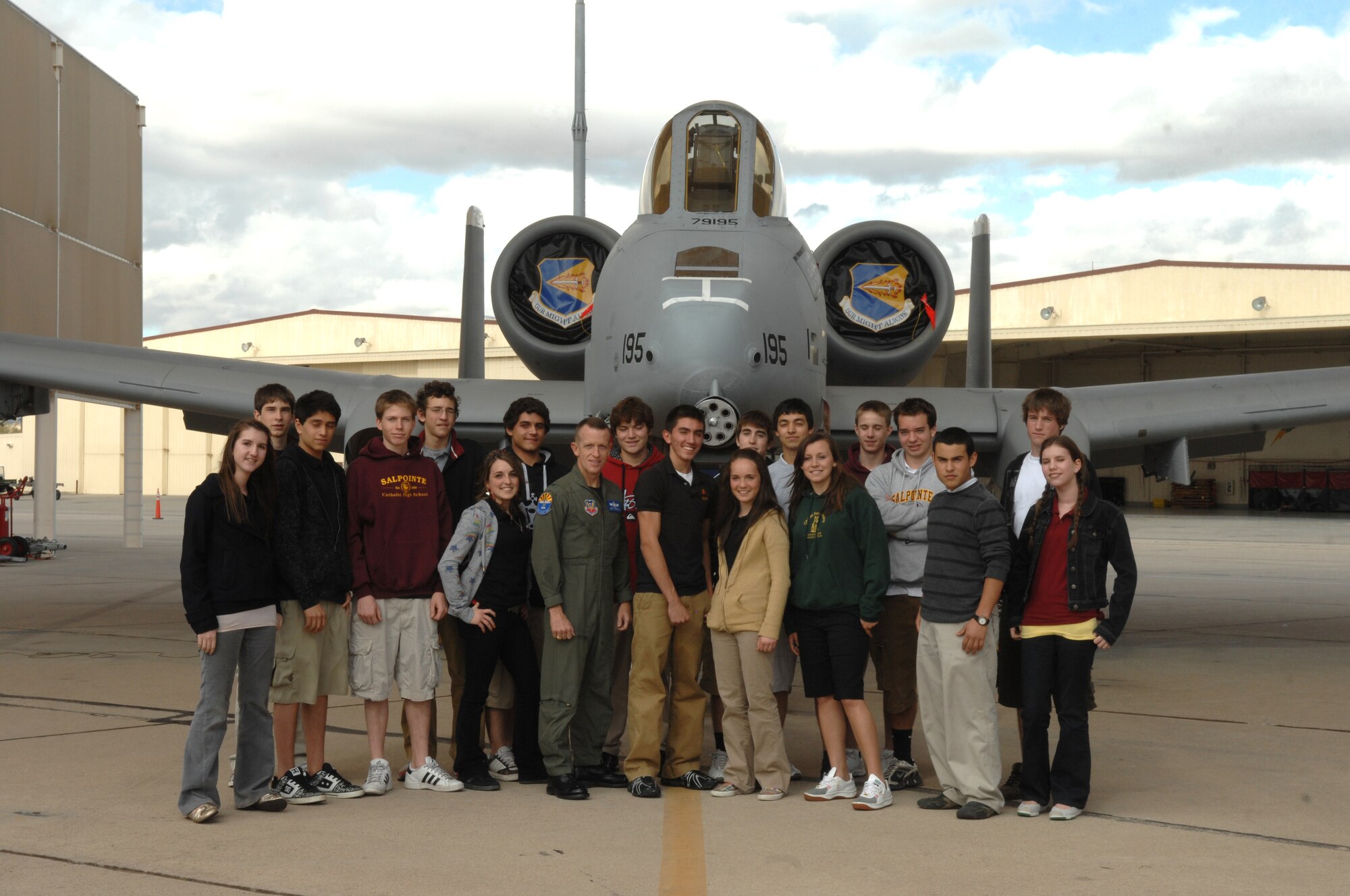 Members of Salpointe Catholic High School’s “American Appreciation Club” pose in front of an A-10 Thunderbolt II aircraft on the flight line here Jan. 24. In November 2007, the patriotic club volunteered their time to support the Tee It Up for the Troops charity golf event and raised funds for the Wounded Warrior Project, which prompted 355th Fighter Wing Commander Col. Kent Laughbaum to invite the group to Davis-Monthan for a tour. The students also saw several other aircraft on the flight line and toured the 309th Aerospace Maintenance and Regeneration Group here. (U.S. Air Force photo/Airman 1st Class Noah Johnson)