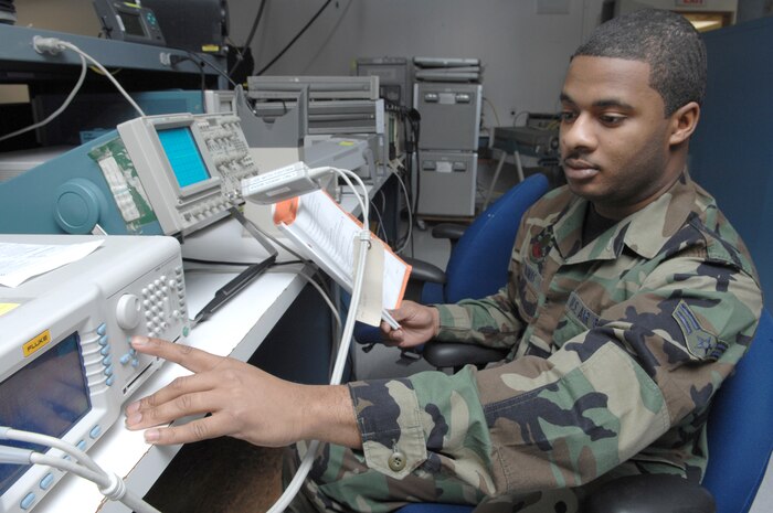 NELLIS AIR FORCE BASE, Nev.—Airman 1st Class Greniko Thomas, 57th Component Maintenance Squadron, precision measuring equipment laboratory apprentice, calibrates an oscilloscope here Jan. 28. The PMEL shop is responsible for making sure all equipment needed to perform Nellis' mission is correctly aligned, measured, and calibrated. (U.S. Air Force photo by Senior Airman Nadine Y. Barclay)