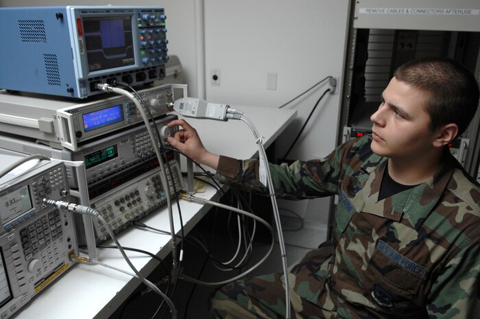 NELLIS AIR FORCE BASE, Nev.—Airman 1st Class Raymond Baccarini, 57th Component Maintenance Squadron, precision measuring equipment laboratory apprentice, measures the pulse characteristics of a signal generator here Jan. 28. The PMEL shop is responsible for making sure all equipment needed to perform Nellis' mission is correctly aligned, measured, and calibrated. (U.S. Air Force photo by Senior Airman Nadine Y. Barclay)