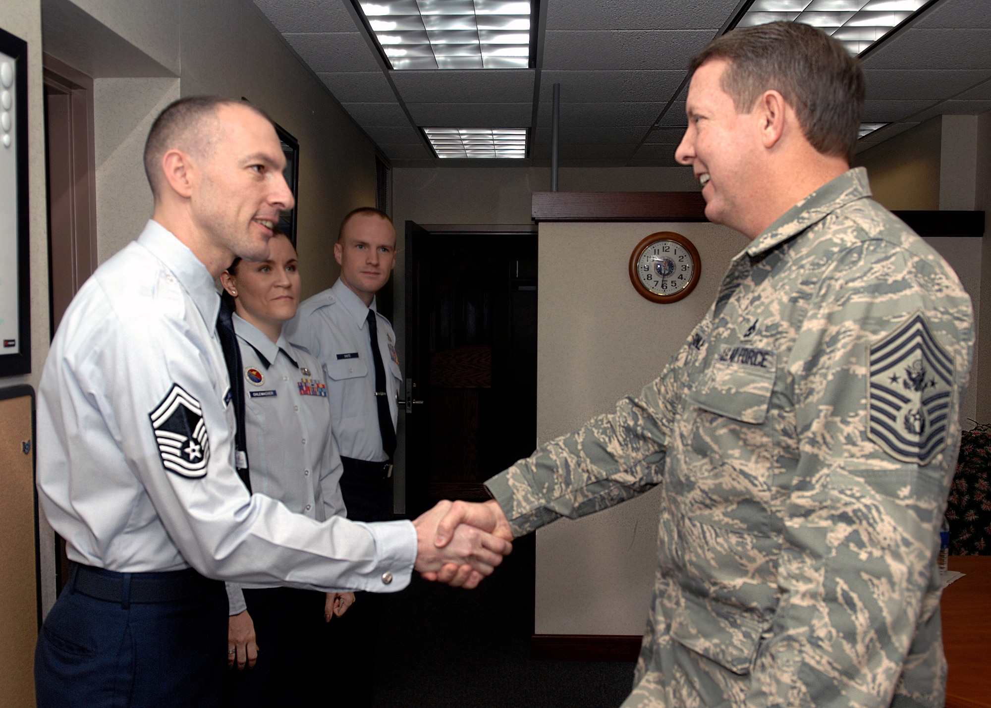 Chief Master Sergeant of the Air Force Rodney J. McKinley greets Senior Master Sgt. Larry Williams during a Jan. 18 visit to Scott Air Force Base's Bud Andres Airman Leadership School in Illinois. Sergeant Williams is the Tanker Airlift Control Center acting first sergeant. (U.S. Air Force photo/Airman 1st Class Megan Gilliand) 
