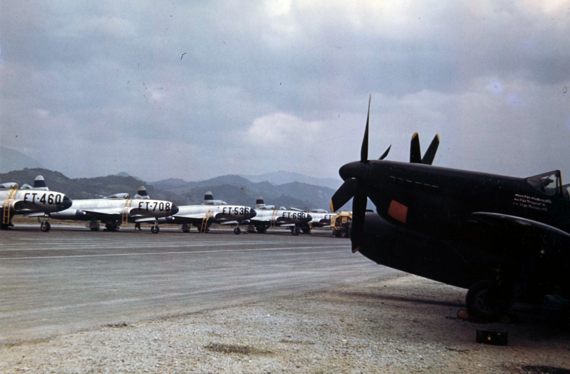 The flightline at Itazuke Air Base, Japan, 1950. The F-82 in the foreground belongs to the 69th All Weather Fighter Squadron, and the F-80s are assigned to the 8th Fighter-Bomber Group. (U.S. Air Force photo)