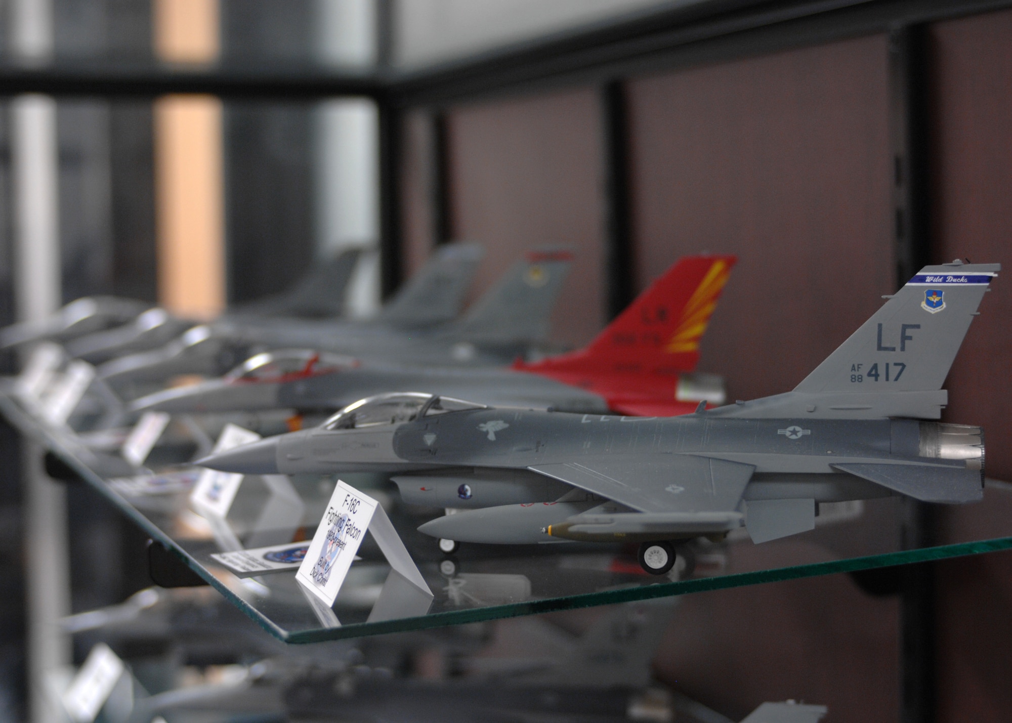Thirty model aircraft and a miniature replica of the Luke water tower were donated by the Craig Hewitt chapter of the International Modelers’ Society are now on display at the base library. The organization presented the model collection to Brig. Gen. Tom Jones and dedicated them to those who serve at Luke. (photo by Tech. Sgt. Raheem Moore)
