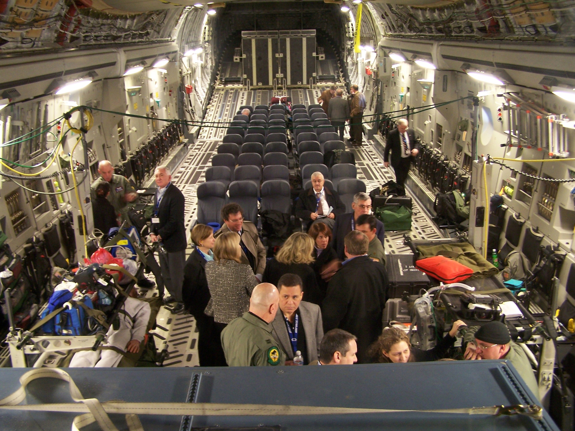 An air evacuation crew from the 183rd Aeromedical Evacuation Squadron in Jackson, Miss., and a Critical Care Air Transport Team from the 81st Medical Group, Keesler Air Force Base, Miss., explain the processes involved in transporting patients aboard a C-17 aeromedical evacuation flight to a group of high-level medical professionals on Jan. 23, part of a National Civic Outreach tour enroute to Wilford Hall Medical Center in San Antonio, Texas.  (U.S. Air Force photo by Master Sgt. Chris
Miller)
  
