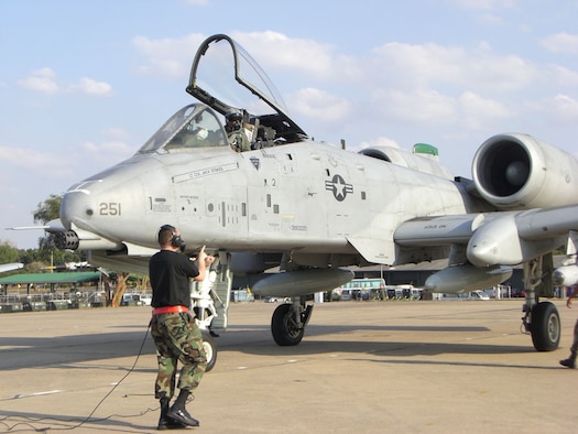 KORAT ROYAL THAI AIR BASE, Thailand -- A maintainer from the 51st Aircraft Maintenance Squadron marshalls an A-10 after landing here from Osan Air Base, South Korea. Six A-10s from the 25th Fighter Squadron arrived here from Osan to participate in Exercise Cope Tiger 2008, a multilateral joint and combined field training and humanitarian and civic assistance exercise involving Thailand, Singapore and the United States. The Thai-, Singaporean- and U.S.-hosted exercise enhances combined readiness and interoperability, reinforces U.S. commitment to the Southeast Asian region, and demonstrates U.S. capability to project combined and joint forces strategically in a multilateral environment. (U.S. Air Force photo by Capt. Renee Lee)