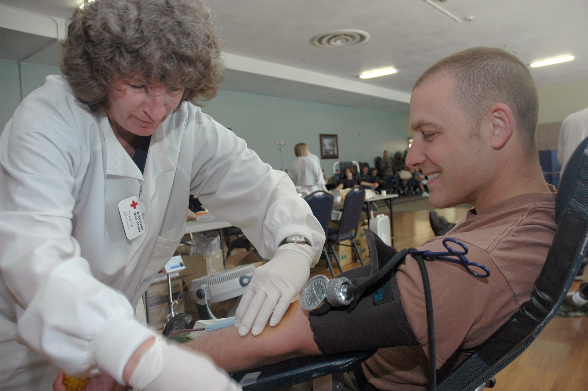 MOUNTAIN HOME AIR FORCE BASE, Idaho -- Teresa Maughan, an American Red Cross phlebotomist, prepares Senior Airman Albert Pierce, 366th Equipment Maintenance Squadron, to donate blood during a 2007 blood drive. The importance of donating blood was made clear Jan. 23 when the wing provided 25 pints of blood to Walter Reed Army Medical Center in Washington D.C. for wounded veterans returning from operations in Iraq and Afghanistan. The center, experiencing an acute shortage of blood, was able to provide critical care to returning veterans until their supplies were replenished. (Air Force photo/ Senior Airman Megan P. Lyon) 