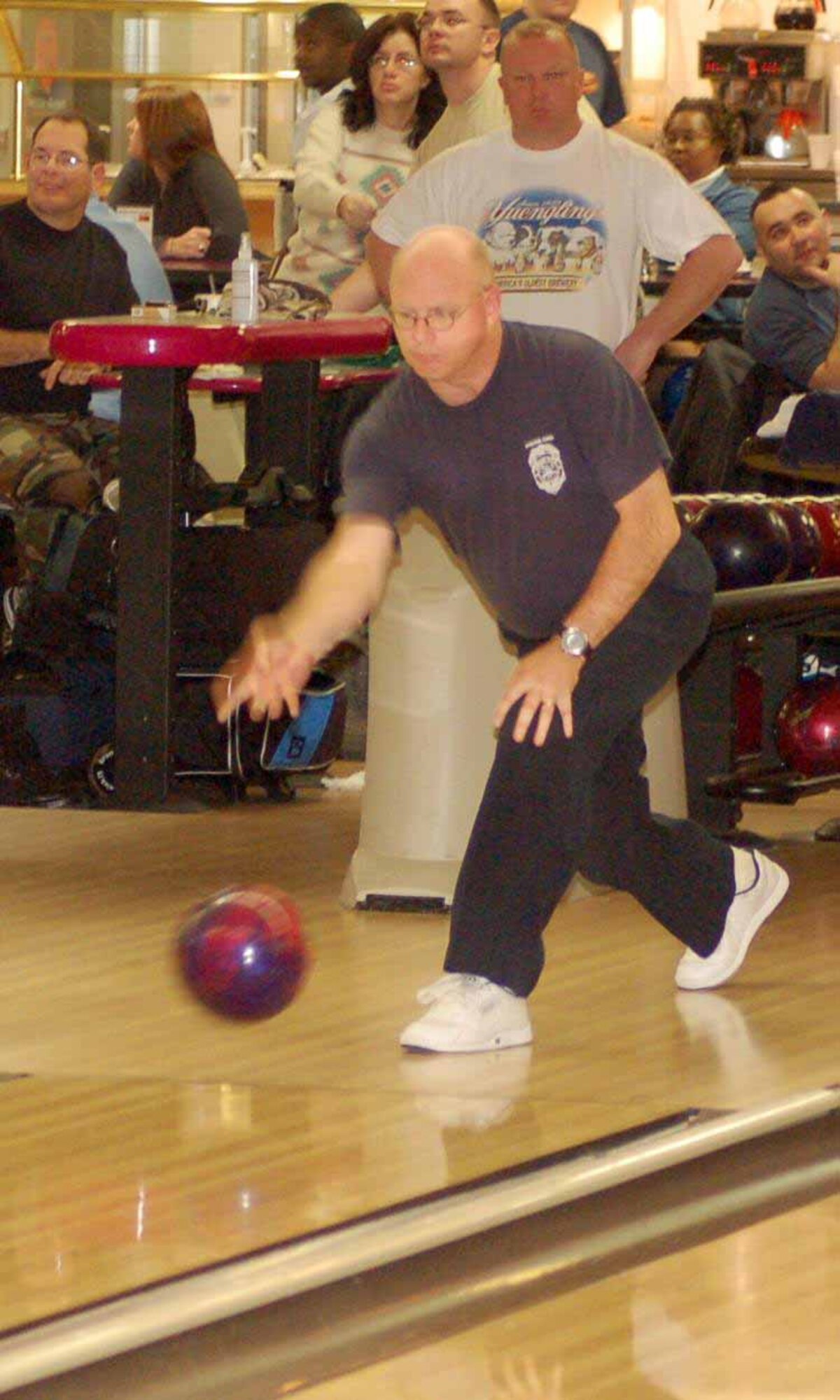 Fire Dawgs bowler Donald Harsley delivers a ball in game one of a match against the 552nd Aircraft Maintenance Squadron Jan. 23 at the Tinker Bowling Center. The 552nd AMXS won 3248-3021.  (Air Force photo by John E. Banks)