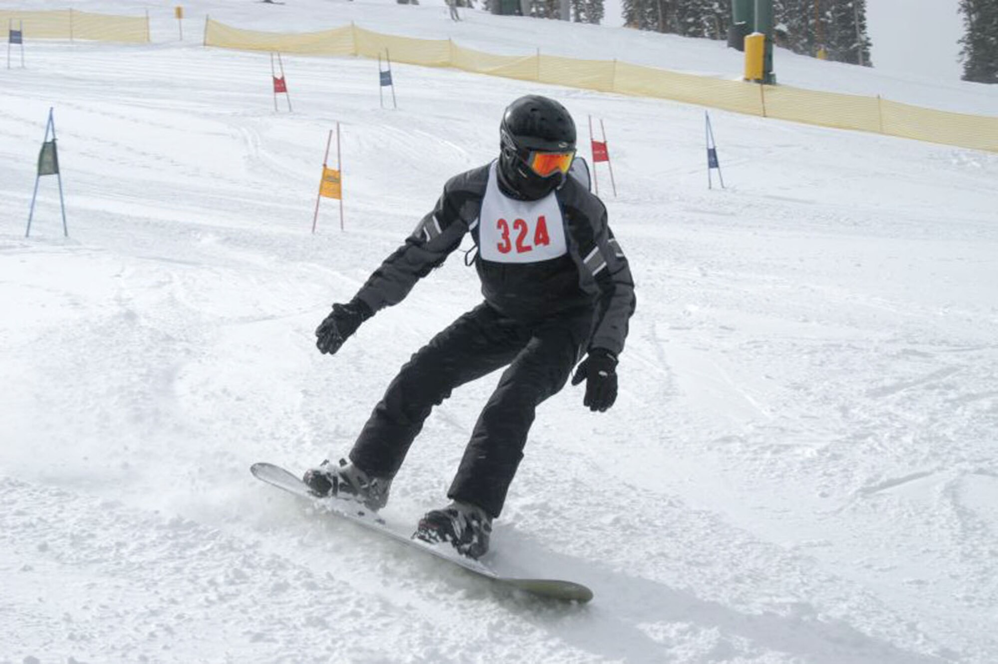 A SnoFest snowboarder cuts through the packed snow during the National Standard Race, or ‘NASTAR’ event Jan. 26. SnoFest, held in Keystone, Colo., is an annual ski weekend targeted at military members and their families. Aapproximately 3,400 servicemembers and their families attended the SnoFest 2008 event.
(U.S. Air Force photo/Todd Ryan)