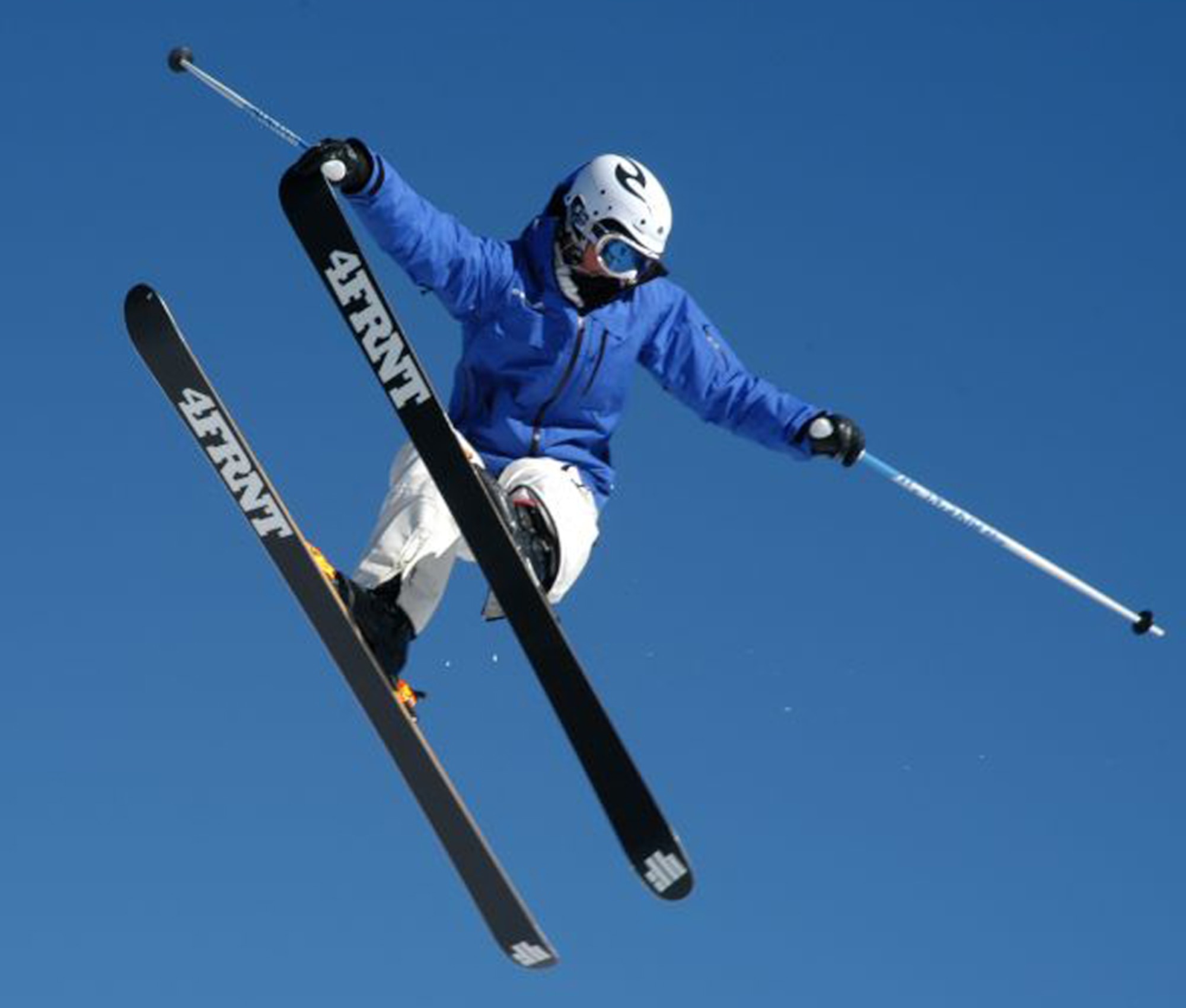 A SnoFest skier flies through the blue Rocky Mountain sky during the National Standard Race, or ‘NASTAR’ event Jan. 26. SnoFest, held in Keystone, Colo., is an annual ski weekend targeted at military members and their families. Approximately 3,400 servicemembers and their families attended the SnoFest 2008 event. (U.S. Air Force photo/Todd Ryan)