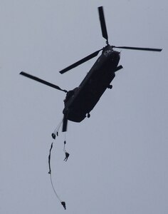 SOTO CANO AIR BASE, Honduras – Honduran soldiers descend from the back of an Army UH-60 helicopter Jan. 24.   More than 250 Honduran soldiers took their first step toward Airborne readiness when they leaped from the back of the helicopter Jan. 24 in a combined jump with U.S. Soldiers here. (U.S. Air Force photo by Martin Chahin)