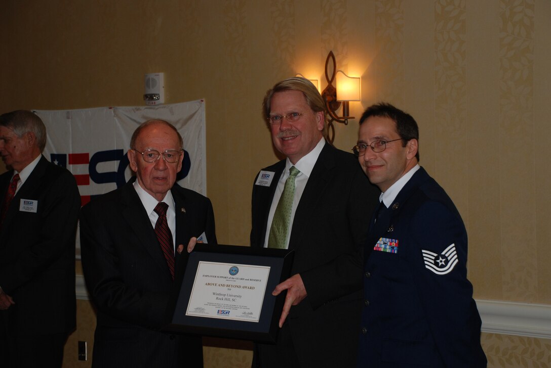 During the S.C. Employer Support of the Guard and Reserve Annual Banquet Staff Sergeant Scott Lovedahl , 315th Civil Engineering Squadron, Charleston Air Force Base, S.C., his employer, Walter Hardin from Winthrop University was honored with the State Chair "Above and Beyond" award from Joel Cassidy, Chair, SC ESGR Committee.  

This award is given in limited numbers and presented annually by each ESGR Committee.  It is designed to honor the employers of Reserve component members that have gone above and beyond the requirements of the Uniformed Services Employment and Reemployment Rights Act (USERRA) within the district, state, commonwealth, or territory for the calendar year.  (Photo by Debra Baldwin)