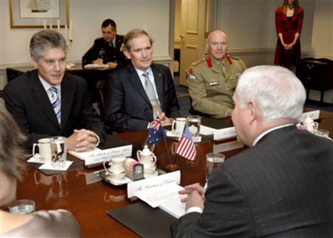 Australian Minister of Foreign Affairs Stephen Smith (left) meets with Secretary of Defense Robert M. Gates (right) in the Pentagon on Jan. 28, 2008.  Under discussion are a variety of bilateral security issues of interest to both nations. Smith was accompanied by Secretary of the Department of Foreign Affairs Michael L'Estrange (center) and Assistant Defense Attaché and Head of the Australian Defense Staff Brig. Rod West (2nd from right).  