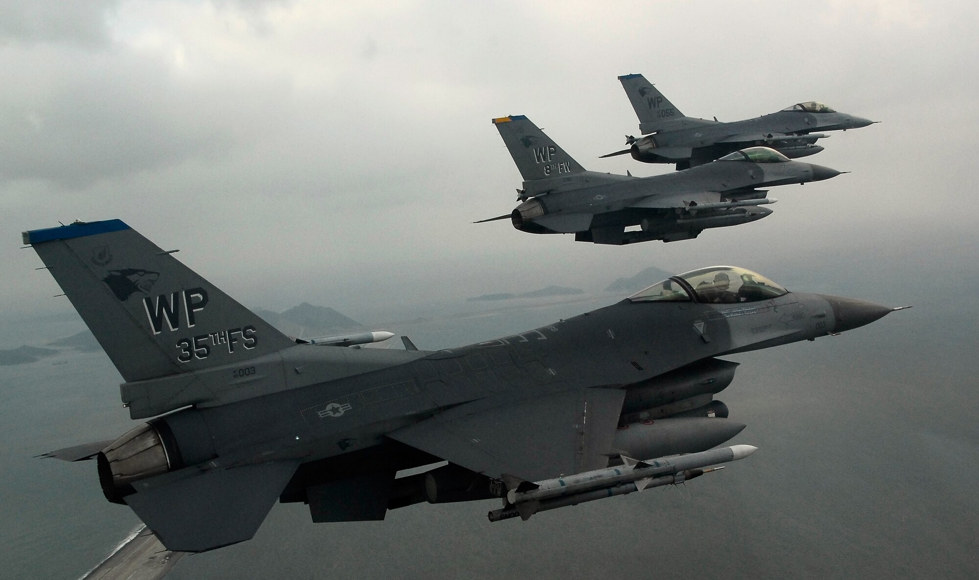 KUNSAN AIR BASE, South Korea -- Pilots from the 35th Fighter Squadron fly a training mission over the South Korean peninsula in F-16 Fighting Falcons, Jan 30.  Pilots assigned to the 35th FS utilize training missions to simulate actual conditions they may face in combat and keep their war-fighting skills honed. (U.S. Air Force Photo/Tech. Sgt Quinton T. Burris)
