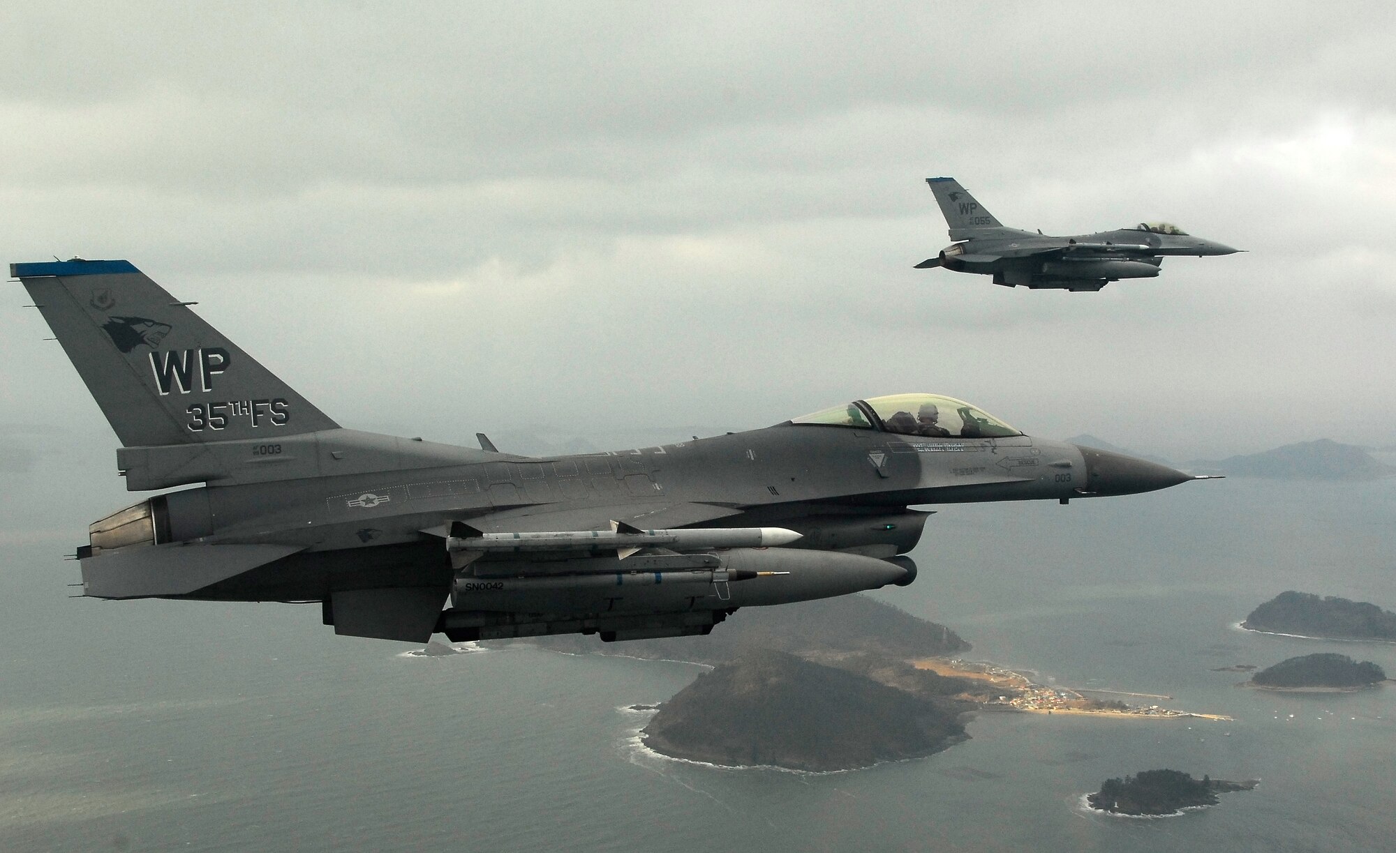 KUNSAN AIR BASE, South Korea -- Pilots from the 35th Fighter Squadron fly a training mission over the South Korean peninsula in F-16 Fighting Falcons, Jan 30.  Pilots assigned to the 35th FS utilize training missions to simulate actual conditions they may face in combat and keep their war-fighting skills honed. (U.S. Air Force Photo/Tech. Sgt Quinton T. Burris)