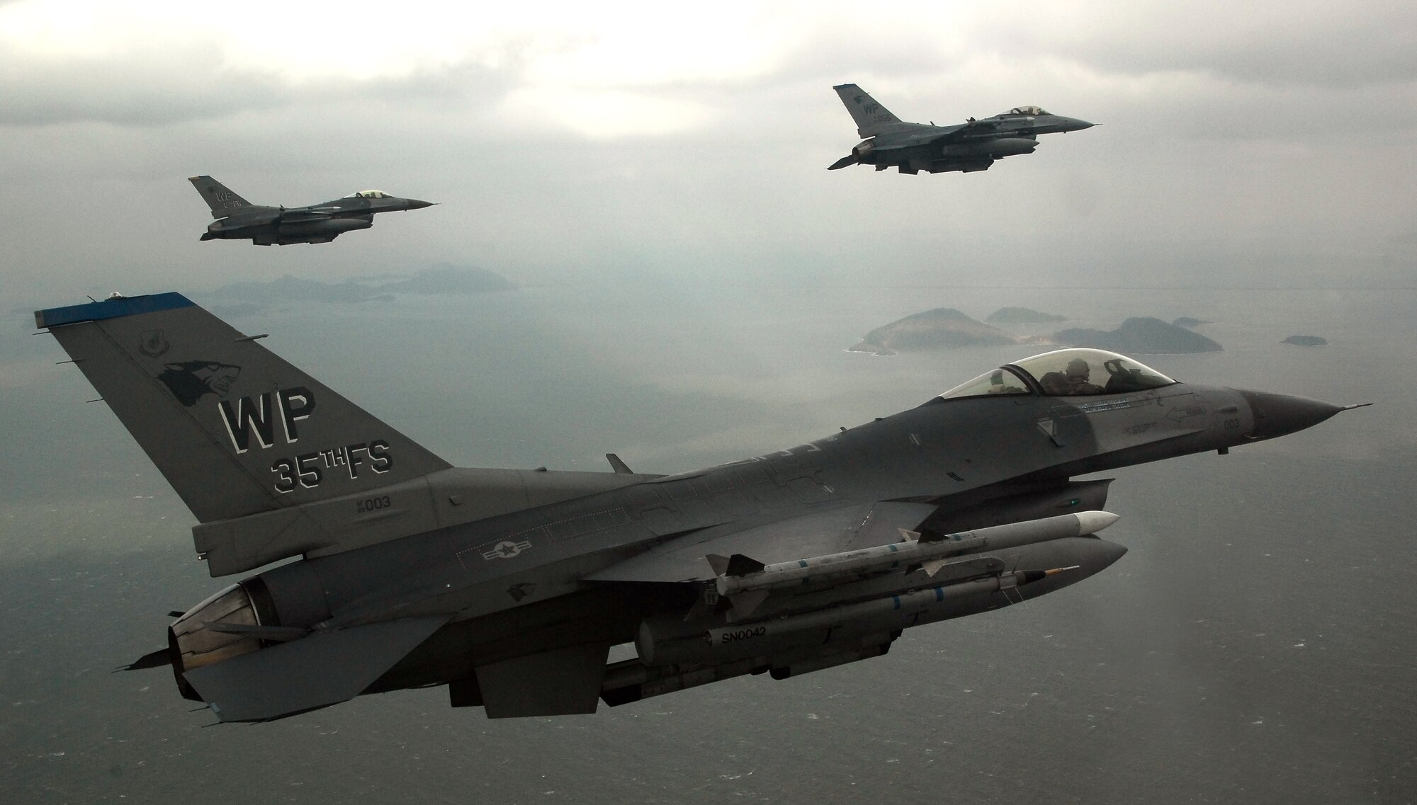 KUNSAN AIR BASE, South Korea -- Pilots from the 35th Fighter Squadron fly a training mission over the South Korean peninsula in F-16 Fighting Falcons, Jan 30.  Pilots assigned to the 35th FS utilize training missions to simulate actual conditions they may face in combat and keep their war-fighting skills honed. (U.S. Air Force Photo/Tech. Sgt Quinton T. Burris)