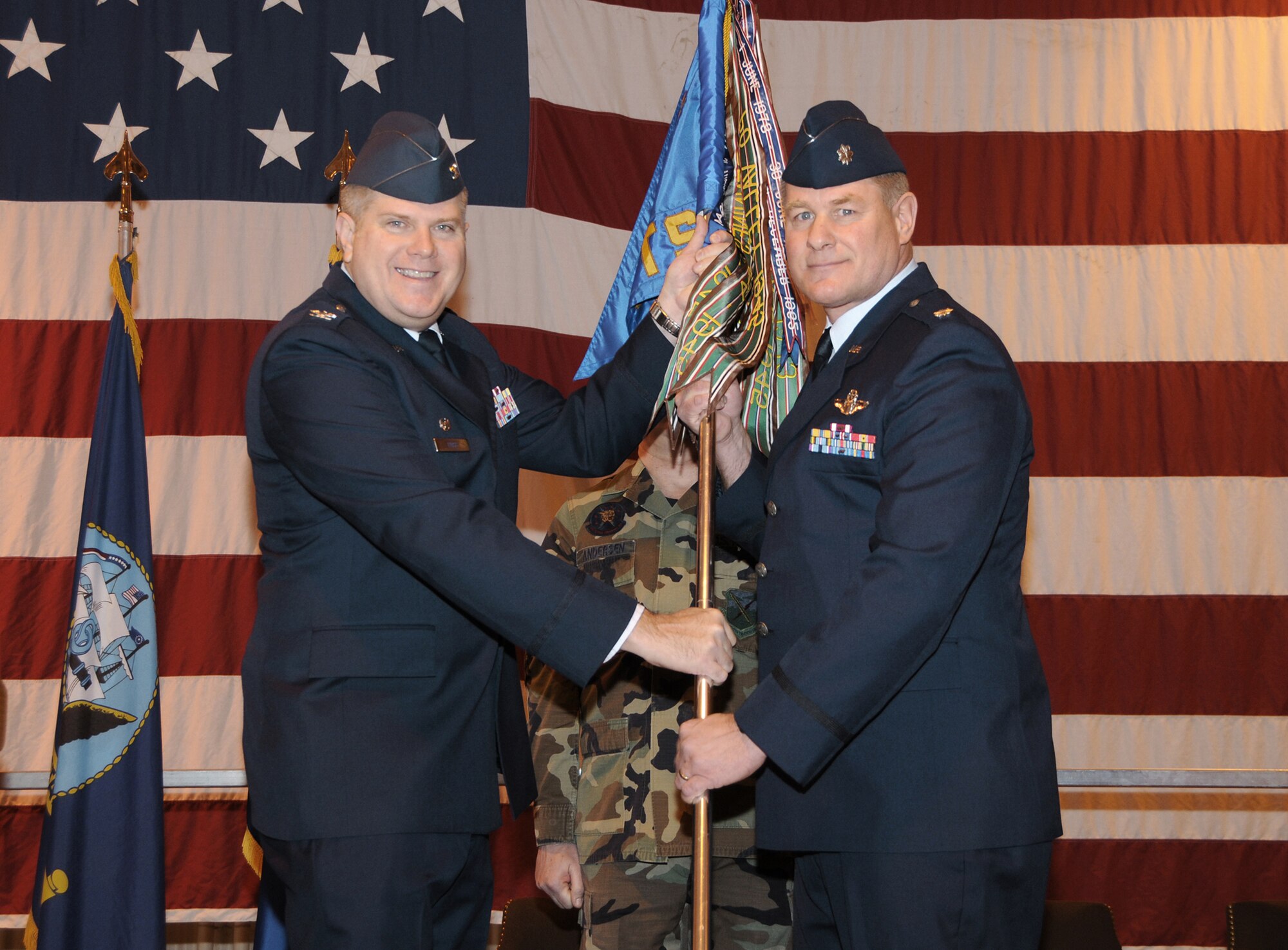 Col. Terry Ross, 340th Flying Training Group commander at Randolph Air Force Base, transfers command of the 5th Flying Training Squadron at Vance AFB to Lt. Col. Kevin L. Kallsen Jan. 25 in Hangar 170. (U.S. Air Force photo by Terry Wasson) 