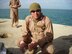 Special Agent James Collins rests after assisting in the rescue of 10 passengers from a C-46 Sea Knight helicopter that crash-landed in the rough 52 degree waters of a lake in Iraq, Dec. 3, 2006. (U.S. Air Force photo)