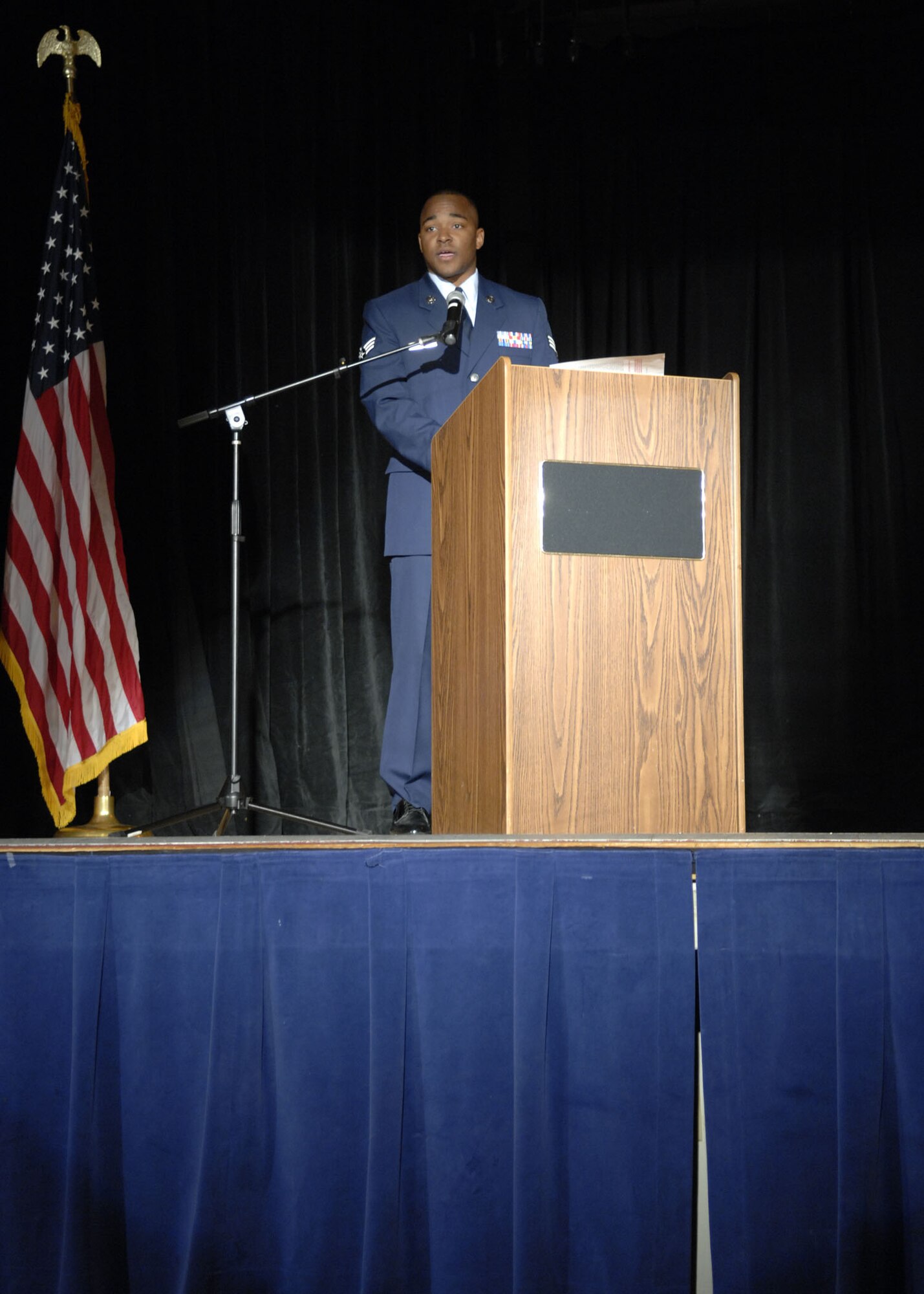 Senior Airmen (SrA) Anthony Nelson, 49th Fighter Wing Public Affairs reads a poem at the Dr. Martin Luther King Jr. Observance Program, Holloman Air Force Base, N.M. on Jan. 25, 2008. This program was put on by the 46th Test Group in remembrance of Dr. King Jr. (U.S. Air Force photo/Airman 1st Class Rachel A. Kocin)