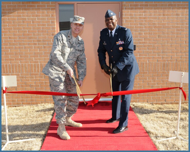 Maj.  Ronald Johnson, chief of Mental Health services and Col. Otha Solomon Jr., 71st Medical Group commander cut a ribbon to open Vance Air Force Base''s new mental health faciility Jan. 22. (U.S. Air Force photo by Terry Wasson)