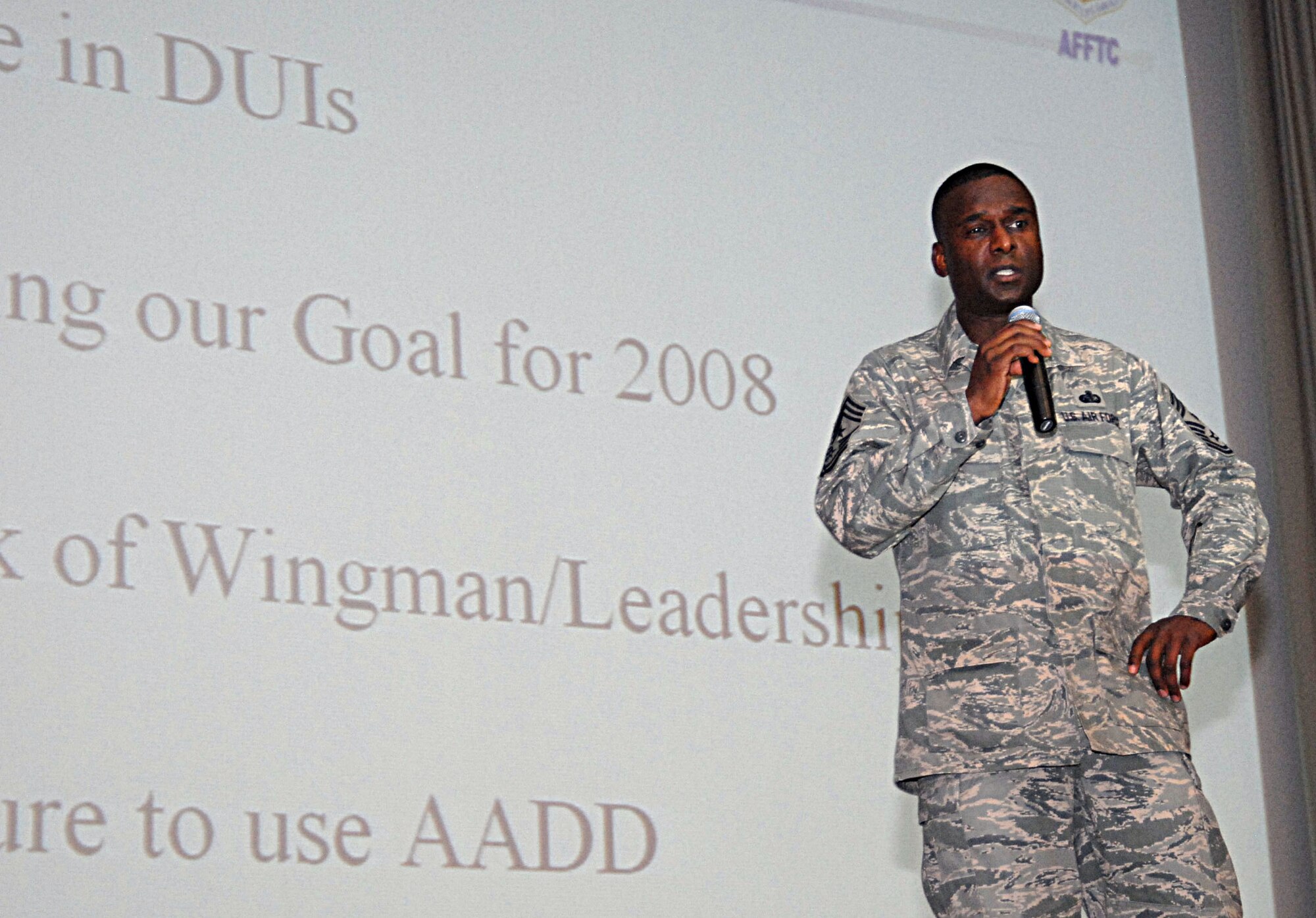 Chief Master Sgt. Juan Lewis, 95th Air Base Wing command chief, addresses the Edwards enlisted force about the consequences of drinking under the influence during an enlisted call Jan. 29 in the base theater here. Since the start of 2008, four Airmen have been stopped for DUIs. (Photo by Senior Airman Julius Delos Reyes)