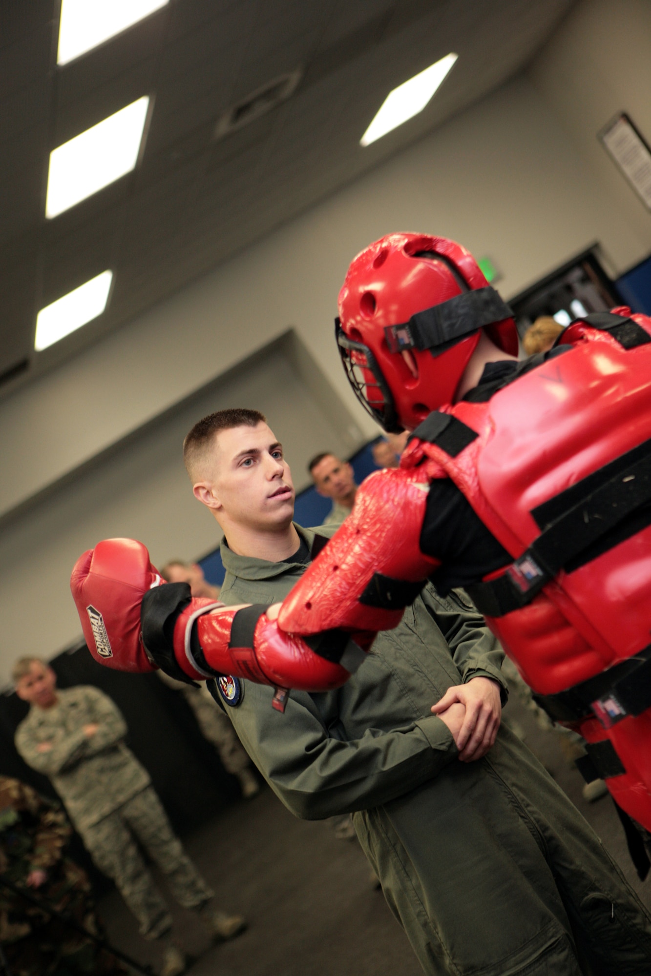 Staff Sgts. James Chubb and Brian Arrington (in red suit), both Phoenix Raven instructors from the U.S. Air Force Expeditionary Center's 421st Combat Training Squadron, participate in a Raven demonstration Jan. 22 in the Center at Fort Dix, N.J.  Raven training is done annually by the 421st CTS preparing security forces Airmen for aircraft security missions at home and abroad.  (U.S. Air Force Photo/Master Sgt. Bob Lorusso)