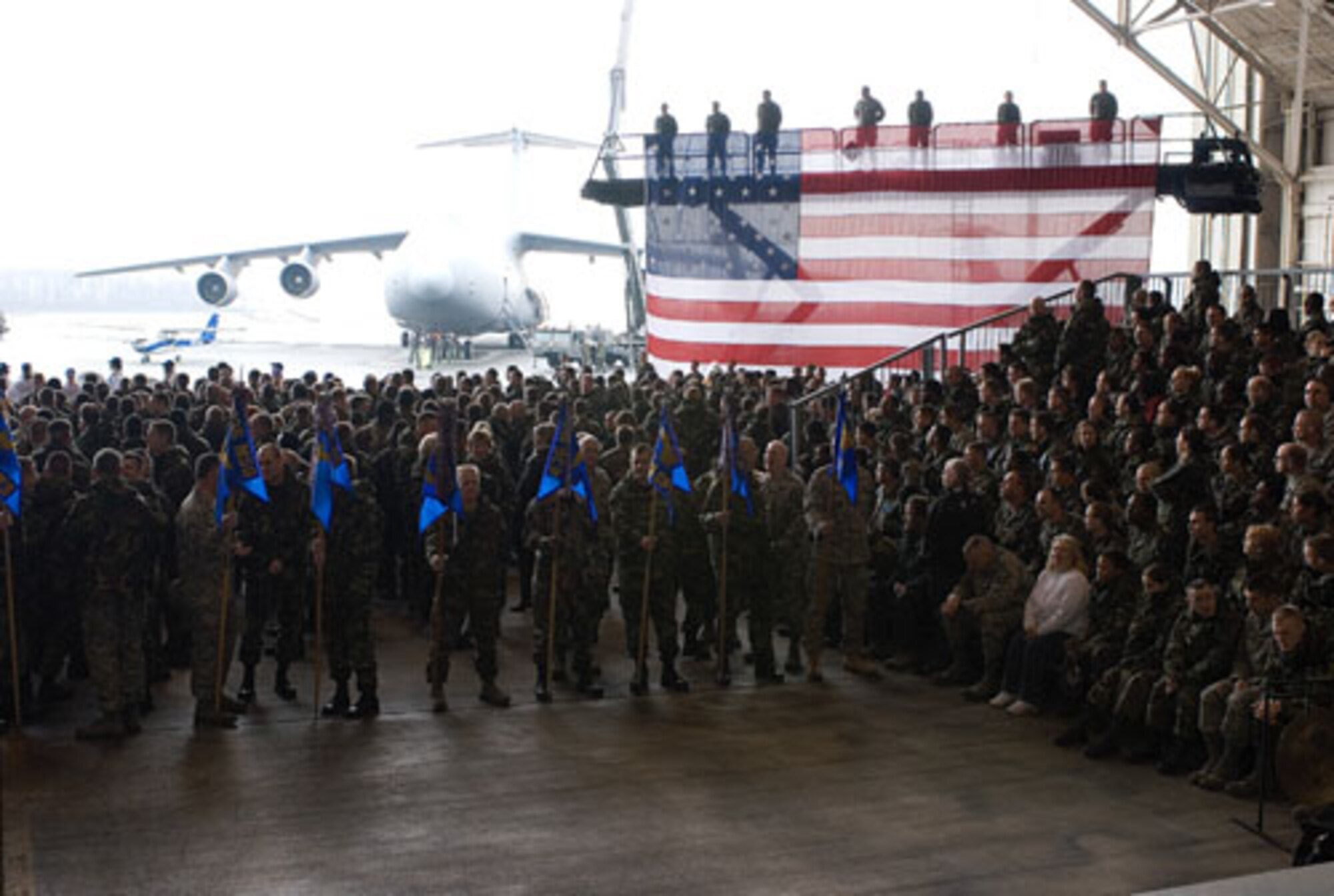 Most of the 436th and 512th Airlift Wing Airmen, tenant-unit servicemembers, Dover's mayor and several other visitors, packed into a maintenance hanger today to the beat of the Dover High School drum line, to celebrate the conclusion of the 2007 Air Force Commander in Chief's Installation Excellence Award inspection. (U.S. Air Force photo/Roland Balik)