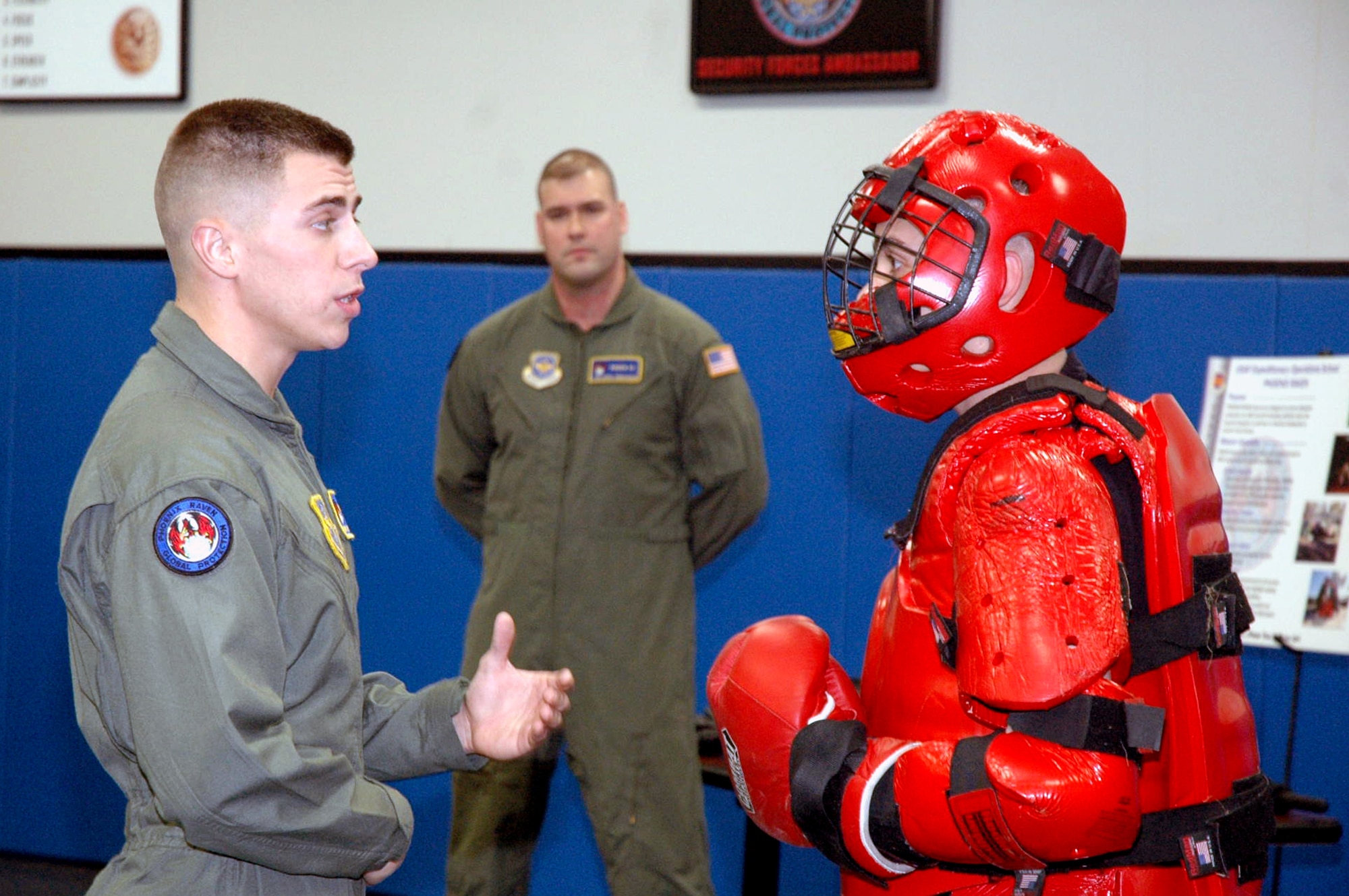 Staff Sgts. James Chubb and Brian Arrington (in red suit), both Phoenix Raven instructors from the U.S. Air Force Expeditionary Center's 421st Combat Training Squadron, participate in a Raven demonstration Jan. 22 in the Center at Fort Dix, N.J.  Raven training is done annually by the 421st CTS preparing security forces Airmen for aircraft security missions at home and abroad.  (U.S. Air Force Photo/Tech. Sgt. Scott T. Sturkol)