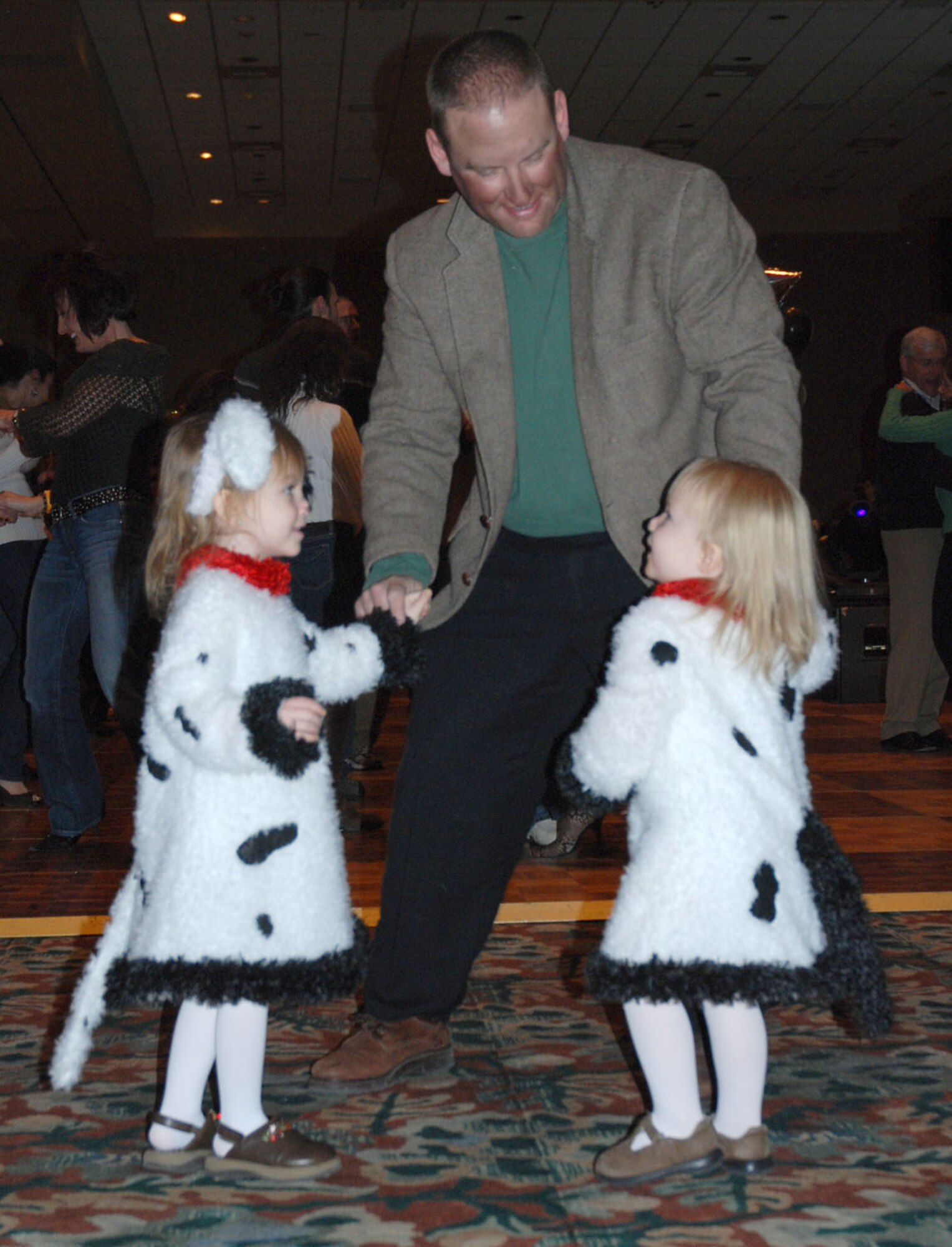 Maj. Michael Marvich, 21st Services Squadron commander, dances the night away with his children as the Air Force band “Pegasus” played classic and new beats for the end-of-SnoFest "Reel Fun" party Jan. 26. SnoFest, held in Keystone, Colo., is an annual ski weekend targeted at military members and their families. Approximately 3,400 servicemembers and their families attended the SnoFest 2008 event. (U.S. Air Force photo/Senior Airman Stephen Collier)