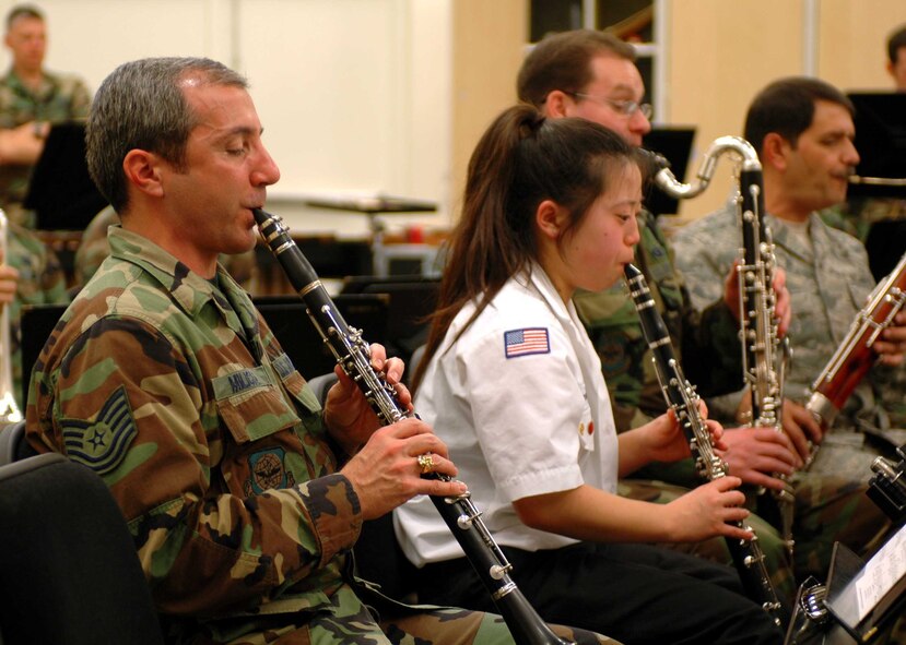 A member of the Peninsula Scout Band practices with the Band of the Golden West, Jan. 25.  The scout band, a co-ed group comprised of high school students, played various pieces of music including “Amazing Grace,” “Esprit de Corps” and “The Liberty Bell.” (U.S. Air Force photo/Nick DeCicco) 