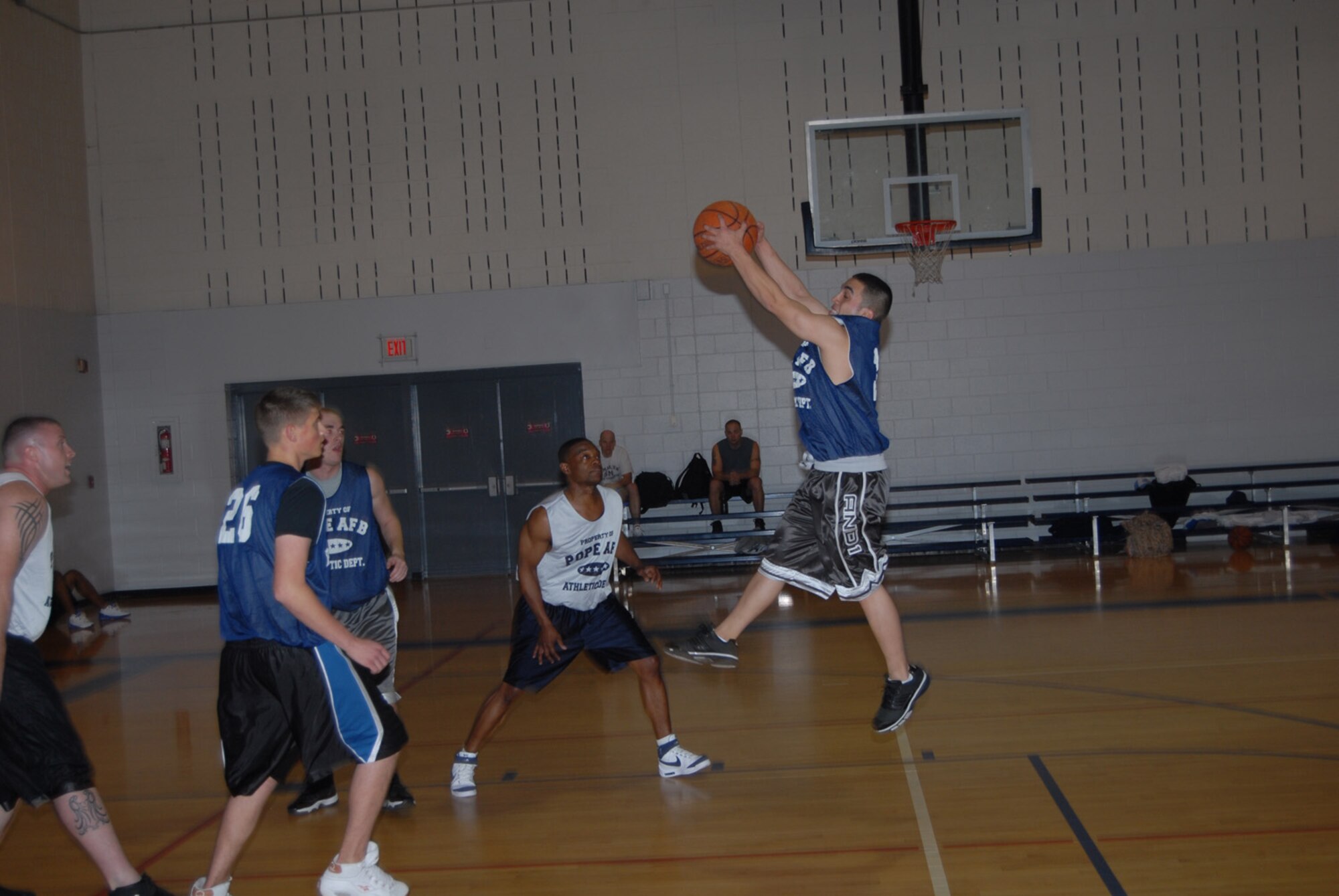 James Aguirre, 3rd Aerial Port Squadron (2), grabs an offensive rebound during the Jan. 24 game against 43rd Civil Engineer Squadron. (U.S. Air Force photo/2nd Lt. Chris Hoyler)