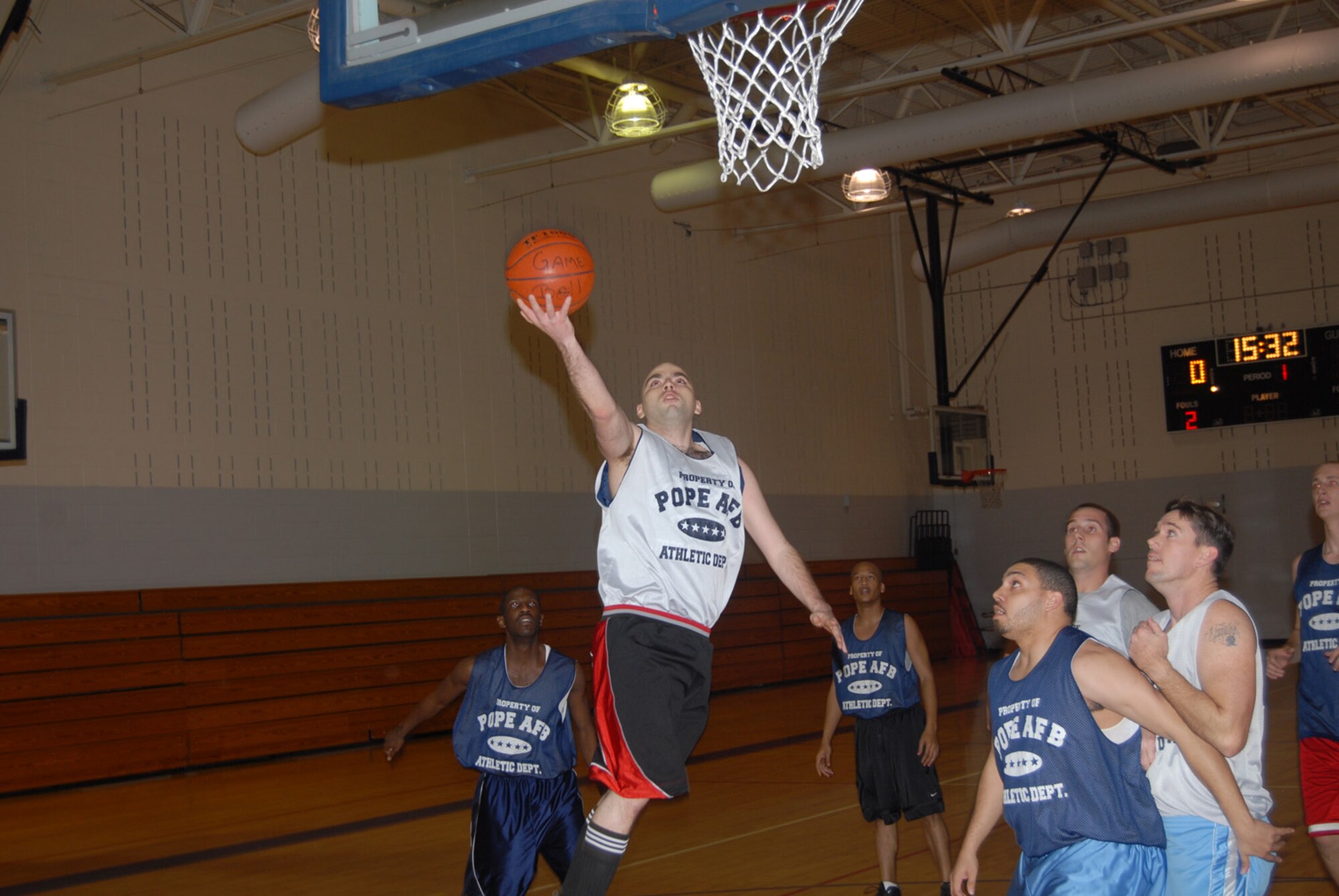 Kevin Paul, 23rd Aircraft Maintenance Squadron, attempts a layup during his team's Jan. 23 game against 43rd Maintenance Squadron. 43rd MSS started the game on a 15-4 run and went on to win by a score of 47-35. (U.S. Air Force photo/2nd Lt. Chris Hoyler)