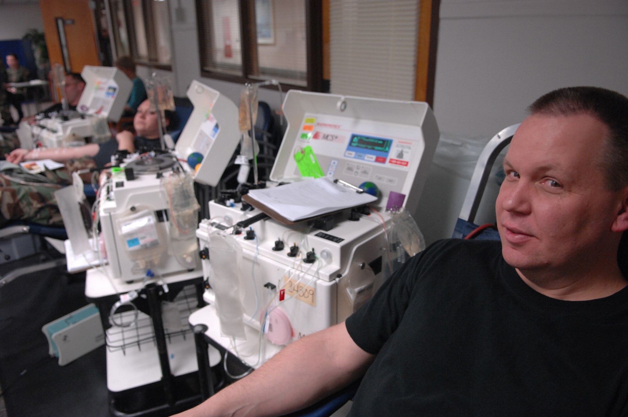 Master Sgt. John Urbas, 28th Medical Operations Squadron Diagnostic Theraputic Flight,  sits and waits for his turn to start donating blood at the 28th Medical Clinic on Jan. 24.  One donor can save two to three lives.  (U.S. Air Force photo by Airman 1st Class Joshua Seybert)