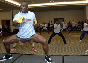 Fitness trainer Billy Blanks instructs Team Charleston Airmen on proper workout techniques during his workout session at the Charleston Club Jan. 28. (U.S. Air Force photo/Airman 1st Class Katie Gieratz)