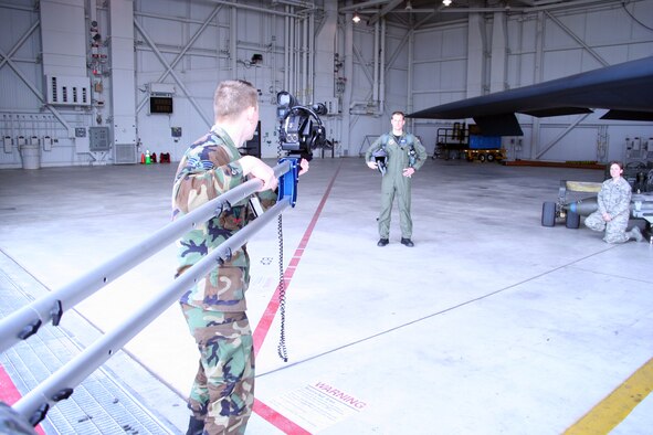 WHITEMAN AIR FORCE BASE, Mo. - Senior Airman John – David Schondelmeyer, 509th Bomb Wing Public Affairs, captures video footage of Capt. Joe Kenothe, 13th Bomb Squadron, during the making of an upcoming video production Jan. 28. The video will be released during an upcoming award ceremony. (U.S. Air Force photo/Airman 1st Class Stephen Linch) 