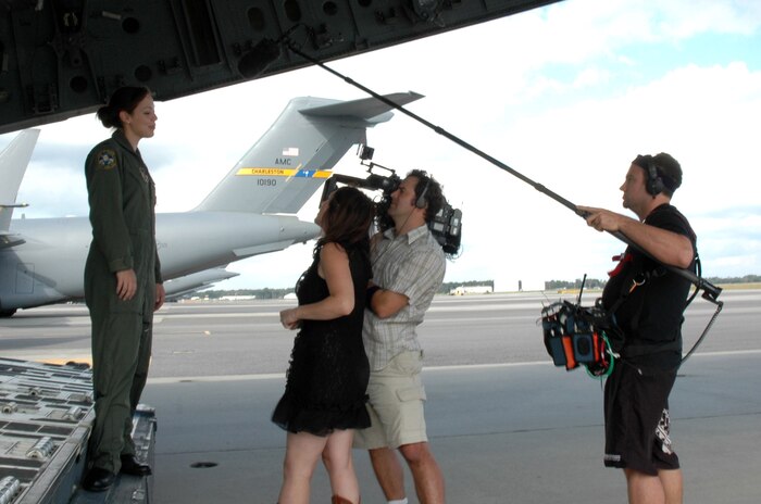 Capt. Lyndsey Goodman is interviewed by a production crew from the TV show "American Idol" at Charleston Air Force Base, S.C. Captain Goodman was highlighted by the show after her audition. She was one of two military contestants featured on the program this season. Captain Goodman is a Reserve C-17 Globemaster III pilot with the 317th Airlift Squadron at Charleston AFB. (U.S. Air Force photo/Staff Sgt. Jeff Kelly) 
