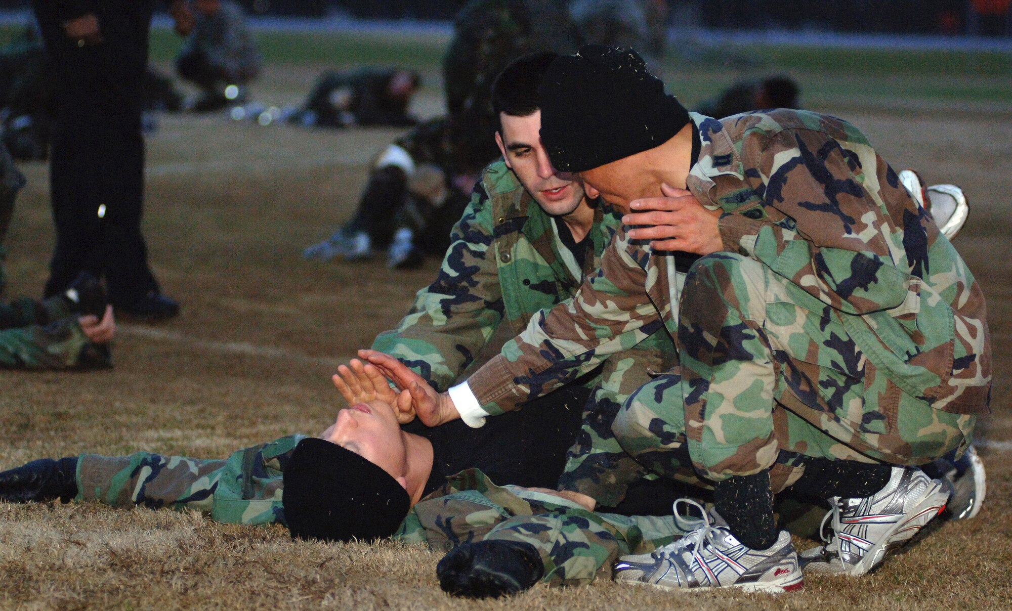 Capt. Jay K. Phomavong shows officer trainees self-defense tactics Jan. 29 during the new Air Force Combative Program course held at Officer Training School at Maxwell Air Force Base, Ala. The course is designed to instill confidence in the trainees' ability to defend themselves; attack and subdue an enemy; develop mental toughness; instill warrior ethos; and provide them with a basic set of unarmed combat skills. Captain Phomavong is the 24th Training Squadron flight commander.(U.S. Air Force photo/Master Sgt. Scott Moorman) 