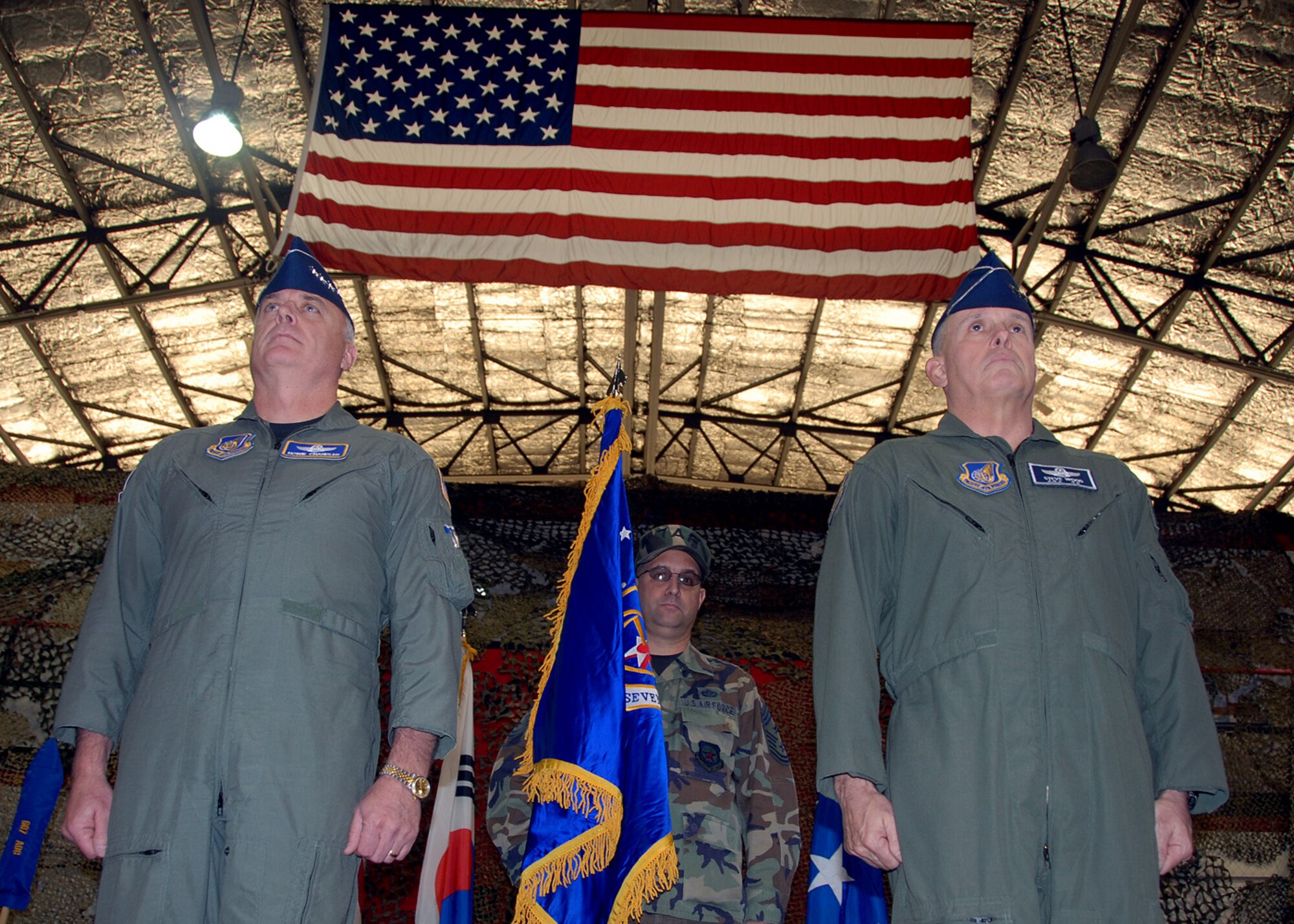 OSAN AIR BASE, Republic of Korea – Gen. Carrol H. “Howie” Chandler, Pacific Air Forces commander, (left) and Lt. Gen. Stephen G. Wood, Seventh Air Force (Air Forces Korea) commander, stand at attention during the Seventh Air Force Re-designation Ceremony Jan. 30. (U.S. Air Force photo/Senior Airman Chad Strohmeyer)