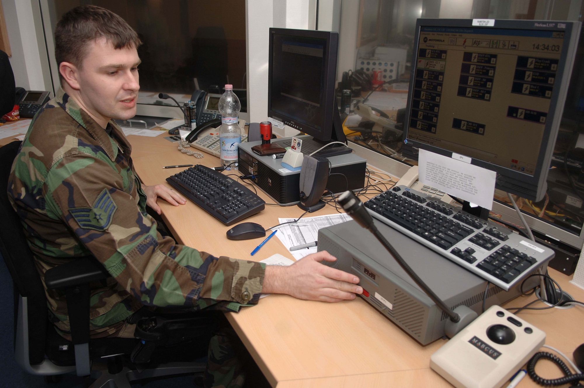 Staff Sgt. Justin Allen, 435th Security Forces Squadron, is working as a combined controller at the renovated Ramstein Law Enforcement Desk. (U.S. Air Force photo/Airman 1st Class Tony Ritter)(RELEASED)