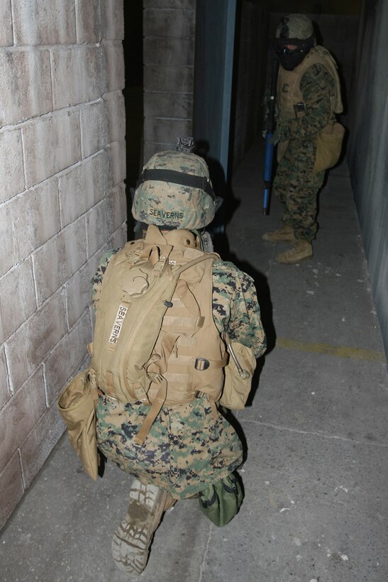 CAMP PENDLETON, Calif., (Jan. 30, 2007)--Marines with Battalion Landing Team 2/5, 15th Marine Expeditionary Unit, train for combat in the new Infantry Immersion Trainer here.::n::The training is designed to give Marines the full experience of combat using state-of-the-art  technology to simulate similar real-life situations.::n::The 15th MEU is preparing for an upcoming deployment to the Western Pacific this summer. (Official USMC photo by Cpl. Kevin McCall) (Released)