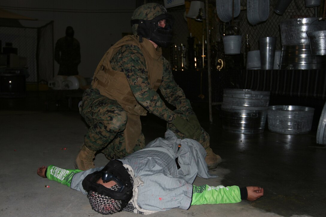 CAMP PENDLETON, Calif., (Jan. 30, 2007)--Marines with Battalion Landing Team 2/5, 15th Marine Expeditionary Unit, train for combat in the new Infantry Immersion Trainer here.::n::The training is designed to give Marines the full experience of combat using state-of-the-art  technology to simulate similar real-life situations.::n::The 15th MEU is preparing for an upcoming deployment to the Western Pacific this summer. (Official USMC photo by Cpl. Kevin McCall) (Released)