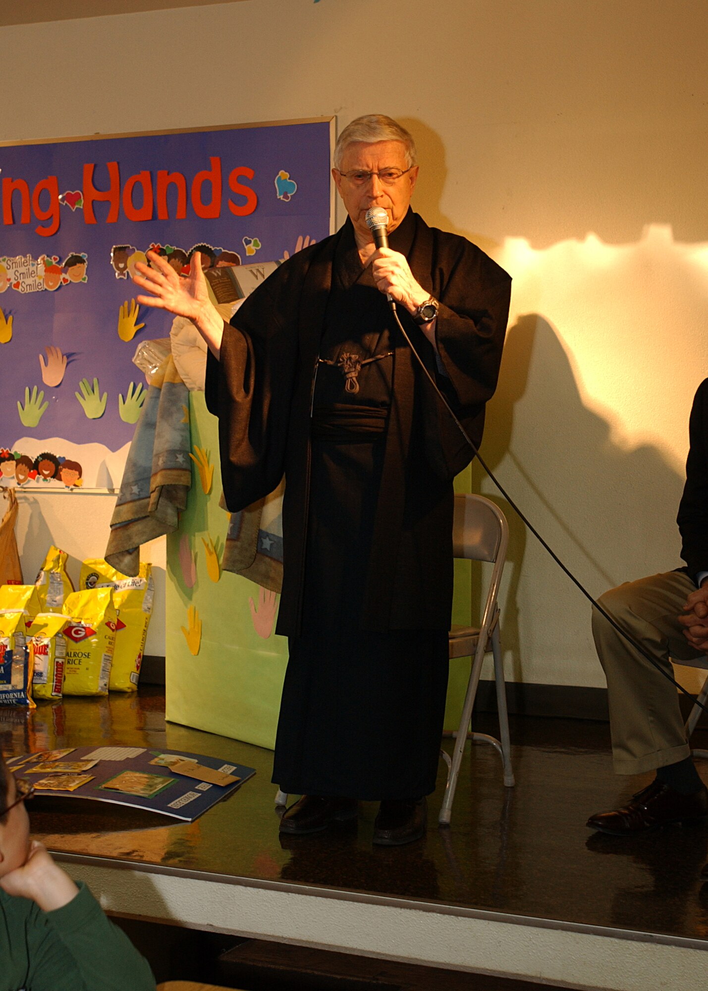 YOKOTA AIR BASE, Japan - Brother Luke Villeneuve, who works with the Homeless Ministry, talks about the homeless to students at the Yokota West Elementary School on Jan 10, 2008. Students donated blankets and rice to the Homeless Ministry that they had gathered over the holidays, some even spending their own money to purchase rice. (U.S. Air Force photo by Airman First Class Jonathan Fowler)