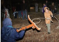 Makala Maydwell takes a shot at roping "cattle" as part of the games and entertainment offered at the Lackland Independent School District Cowboy Breakfast Jan. 25. Nearly 300 children showed up to engage in the festivities and eat from a selection of potato and egg breakfast tacos, biscuits and gravy and grits. Makala is the daughter of Tech. Sgt. Michelle Maydwell and Staff Sgt. Diago Maydwell of Lackland AFB, Texas. (USAF photo by Robbin Cresswell)