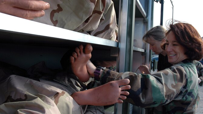 Chief Master Sgt. Chandra Gamble and Lt. Col. Jennifer McCleve put a dummy back on the shelf after inspecting it Jan. 30 at McChord Air Force Base, Wash. The dummy will be used during the Pacific Lifeline exercise Jan. 26 to Feb. 9. More than 900 Department of Defense members are participating in the medical exercise. Chief Gamble is assigned to the 446th Aeromedical Staging Squadron, and Colonel McCleve is from the 446th Aerospace Medicine Squadron. (U.S. Air Force photo/Capt. Jennifer Gerhardt)