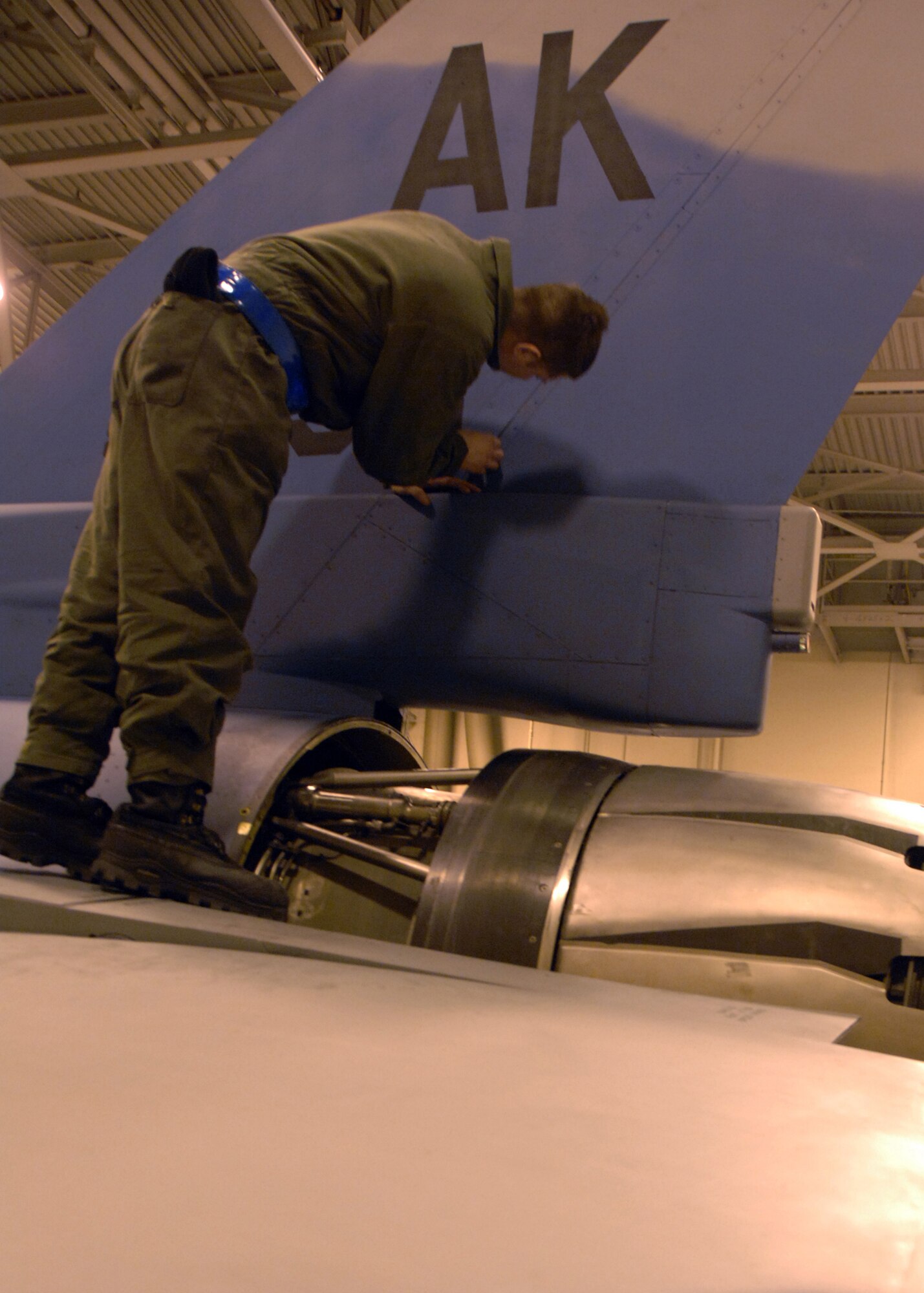 EIELSON AIR FORCE BASE, Alaska --  A crew chief inspects the tail of a newly arrived Aggressor Jan. 30, 2008. The 354th AMXS produces safe and reliable Aggressor aircraft in support of the 18th Aggressor Squadron to prepare the combat Air Force and joint and allied aircrews during exercises such as RED FLAG-Alaska. (U.S. Air Force photo by Airman 1st Class Christopher Griffin)
 
