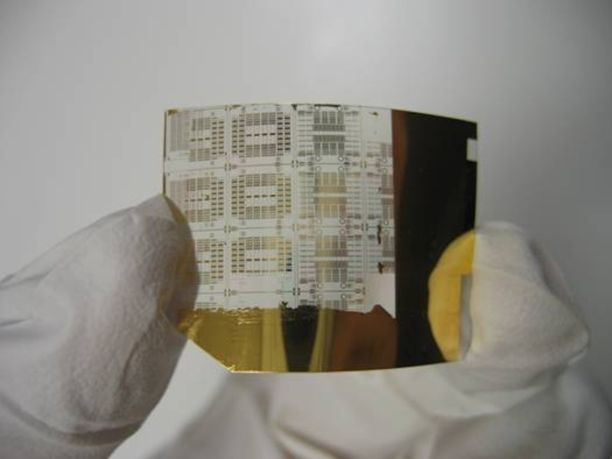 The flexibility of super-thin silicon transistors, such as the one pictured, could lead to electronics attached to unevenly shaped objects like airplane bodies or engines. (Image courtesy of Dr. Jack Ma, University of Wisconsin-Madison)