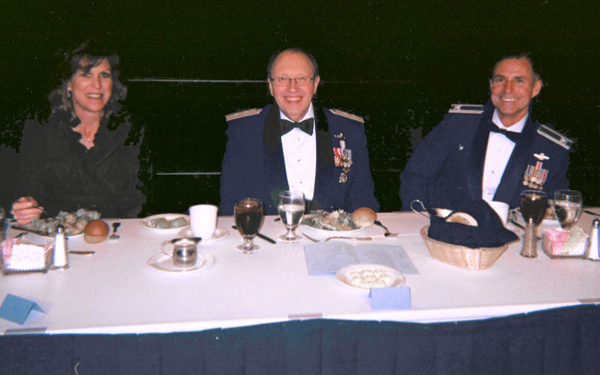 The 301st Fighter Wing's Annual Awards Banquet head table enjoys their meal and the sounds of the Sunder Strings Quartet who provided chamber music during the dinner hour. From left to right seated are Mrs. Ann Pottinger, wife of the 301st Fighter Wing commander, Maj. Gen. Charles Stenner, Jr., Assistant Deputy Chief of Staff for Strategic Plans and Programs, and Col. Kevin Pottinger, 301st FW commander. (U.S. Air Force Photo)