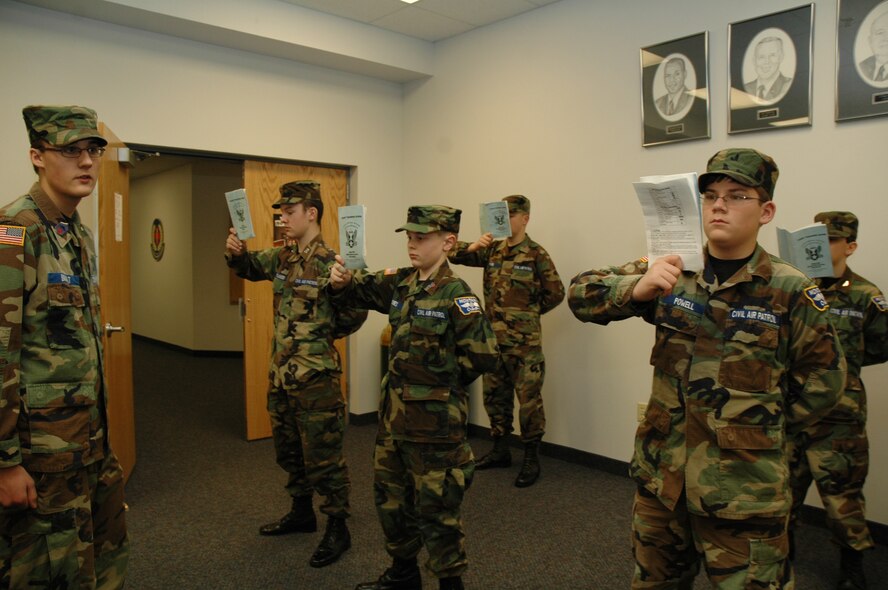 Civil Air Patrol cadets study their reading material as they wait for a uniform inspection, which Cadet Chief Chris Brault supervises. CAP held an encampment at Malmstrom from Jan. 11 to 27. (U.S. Air Force photo/Airman 1st Class Emerald Ralston)