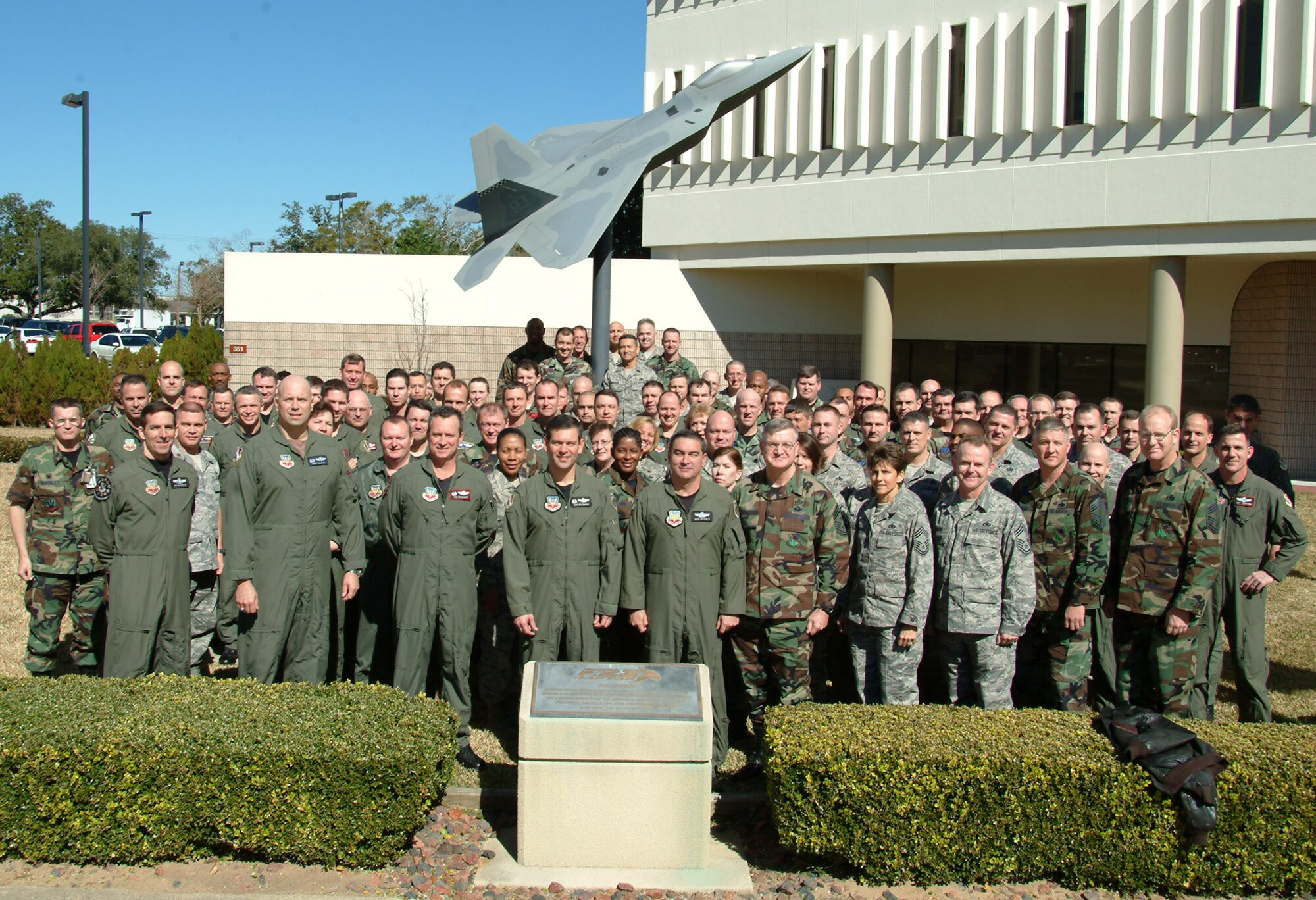 The 53d Wing commanders and senior enlisted leadership came together Jan. 30 for a photo in front of the headquarters building at Eglin Air Force Base.  Air Force photo by Staff Sgt. Samuel King Jr.