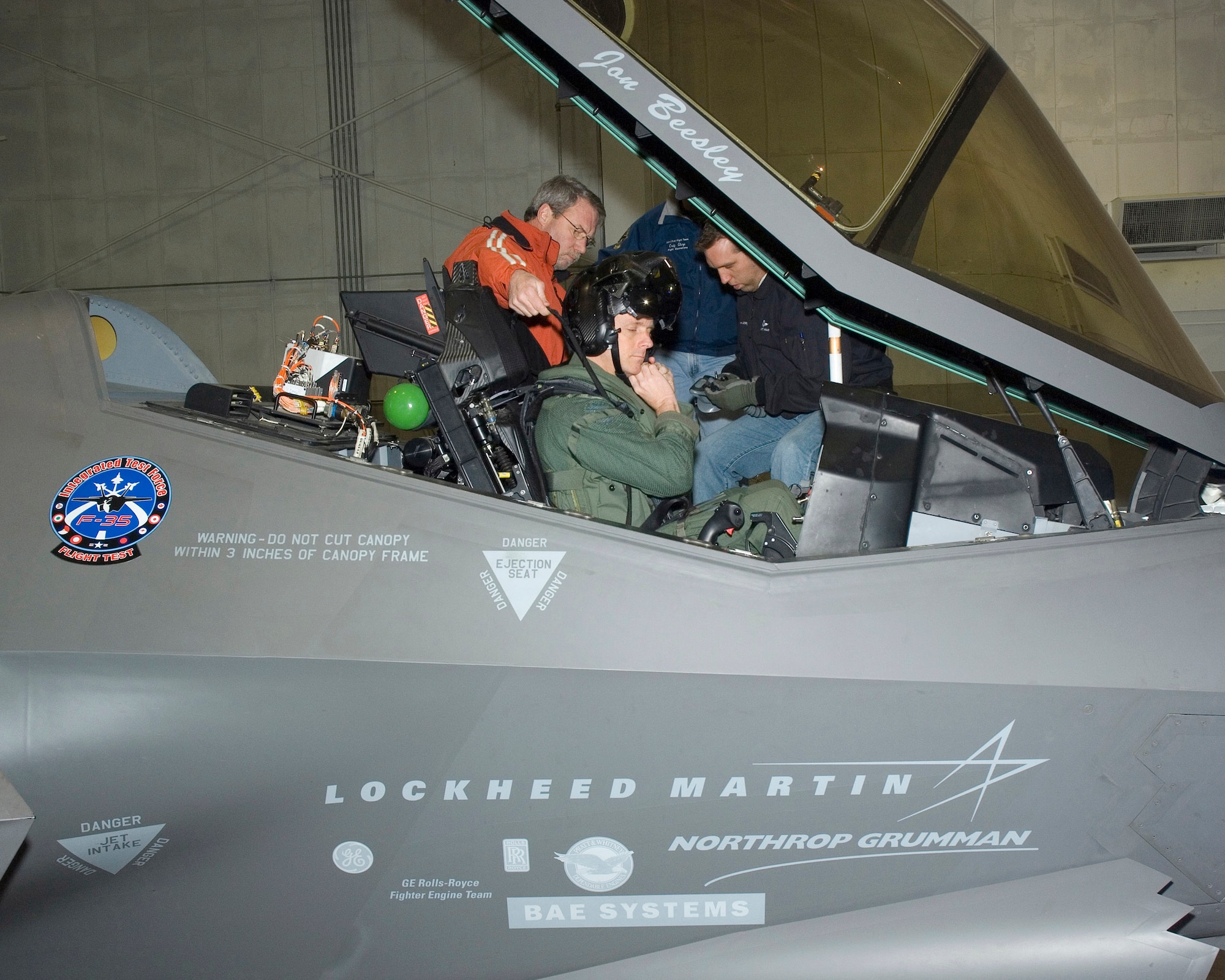 Lt. Col. James Kromberg adjusts his helmet as he prepares to fly the F-35 Lightning II Jan. 30 at the Lockheed Martin facility at Naval Air Station Fort Worth, Texas. Colonel Kromberg's test flight marks the first time a military pilot flew the F-35. He is the 461st Flight Test Squadron director of operations. (Courtesy photo) 

