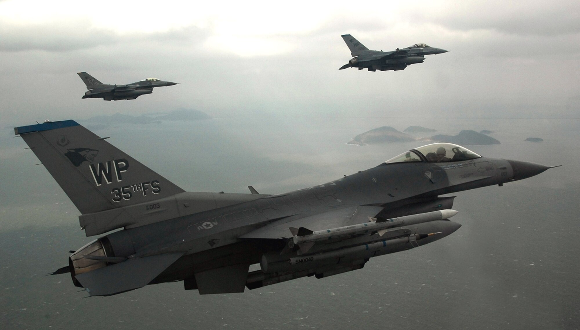 F-16 Fighting Falcons fly on a training mission Jan. 30 over the South Korean peninsula. F-16s can locate targets in all weather conditions and detect low flying aircraft in radar ground clutter. Pilots assigned to the 35th Fighter Squadron from Kunsan Air Base, South Korea, use training missions to simulate actual conditions they may face in combat and keep their warfighting skills honed. (U.S. Air Force photo/Tech. Sgt Quinton T. Burris)
